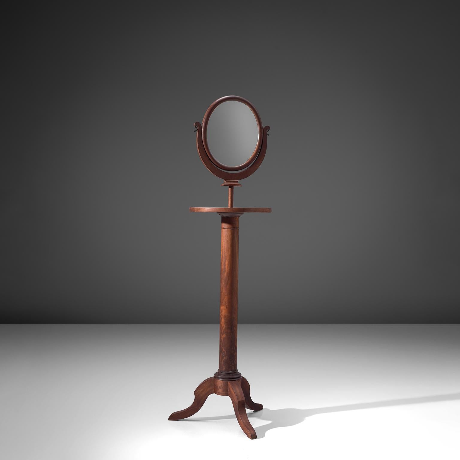 Mirror, walnut, glass, Italy, 1940s

This freestanding mirror is executed in walnut. It has an oval mirror, placed on a pedestal base with three legs. The height and angle of this mirror is easily adjustable to a height of 182 cm. It can be placed
