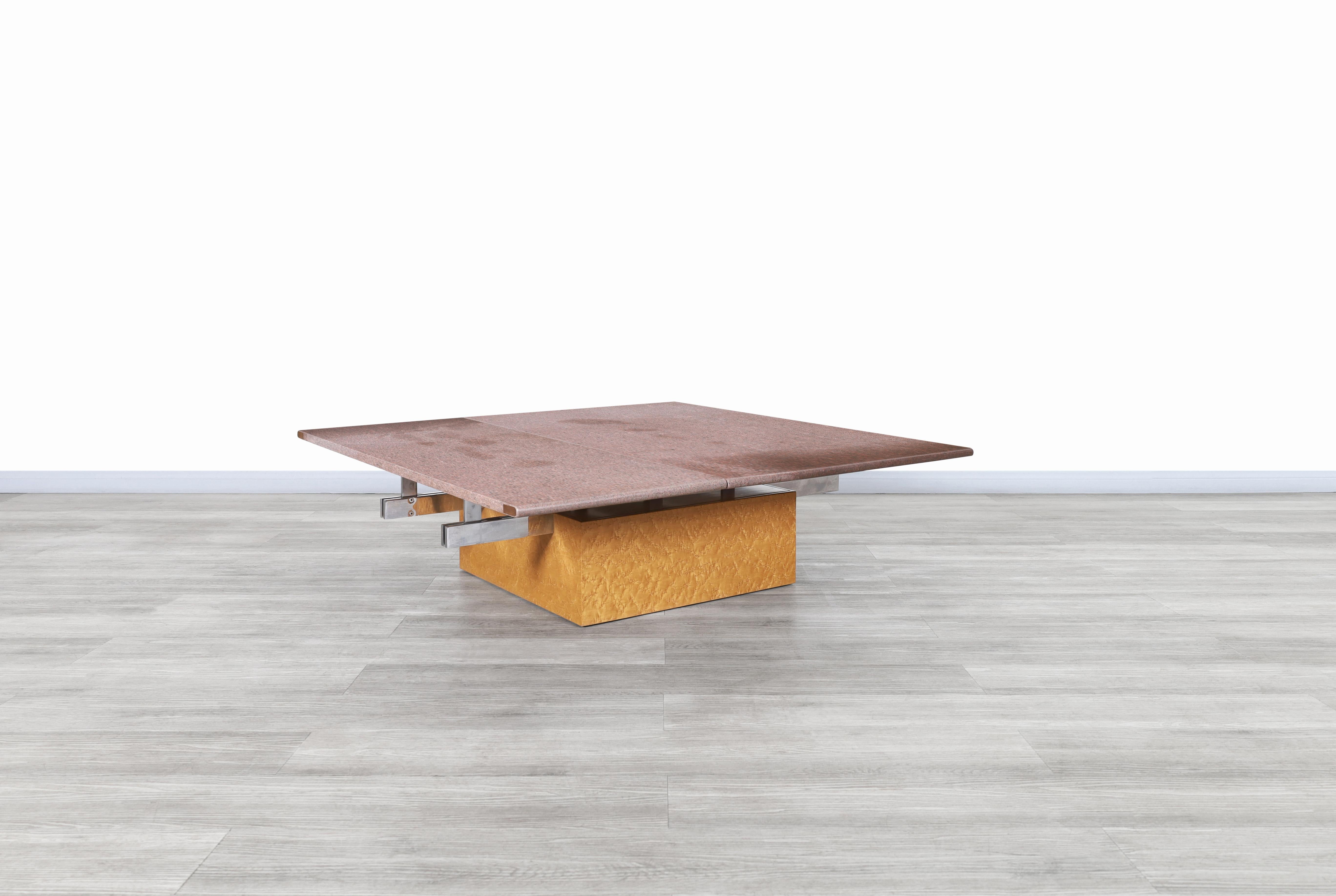 Stunning vintage Italian adjustable bird's-eye maple and granite coffee table designed by Giovanni Offredi for Saporiti in Italy, circa 1980s. This table has a fascinating design, where the materials used in its construction stand out combined with