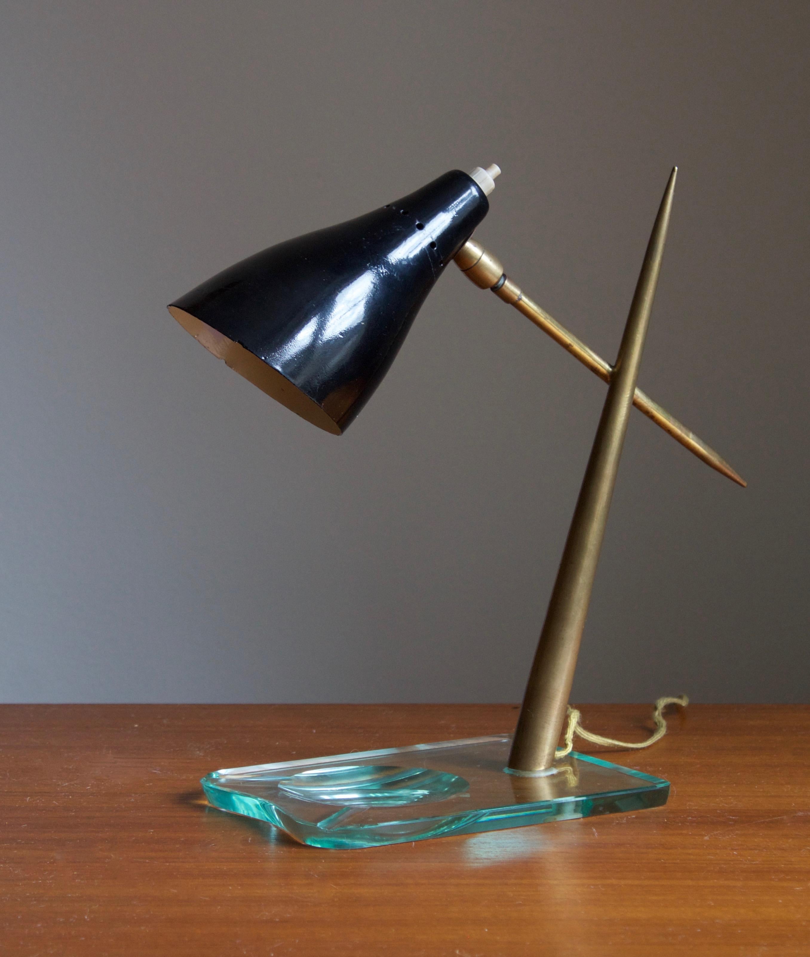 An adjustable table lamp. In wood, metal, and copper. Sourced in Italy. 

Other designer of the period include Gio Ponti, Franco Albini, Angelo Lelii, and Max Ingrand.
