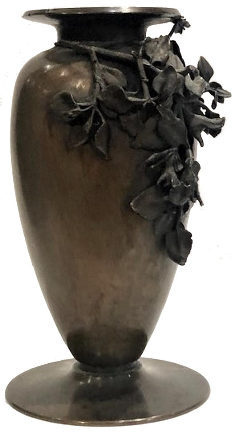 This amazingly elegant bronze vase, the only decoration of which is a bunch of flowers, is a striking example of Italian applied art of the late 19th century, at the junction of two dominant art movements of that era - Aestheticism and