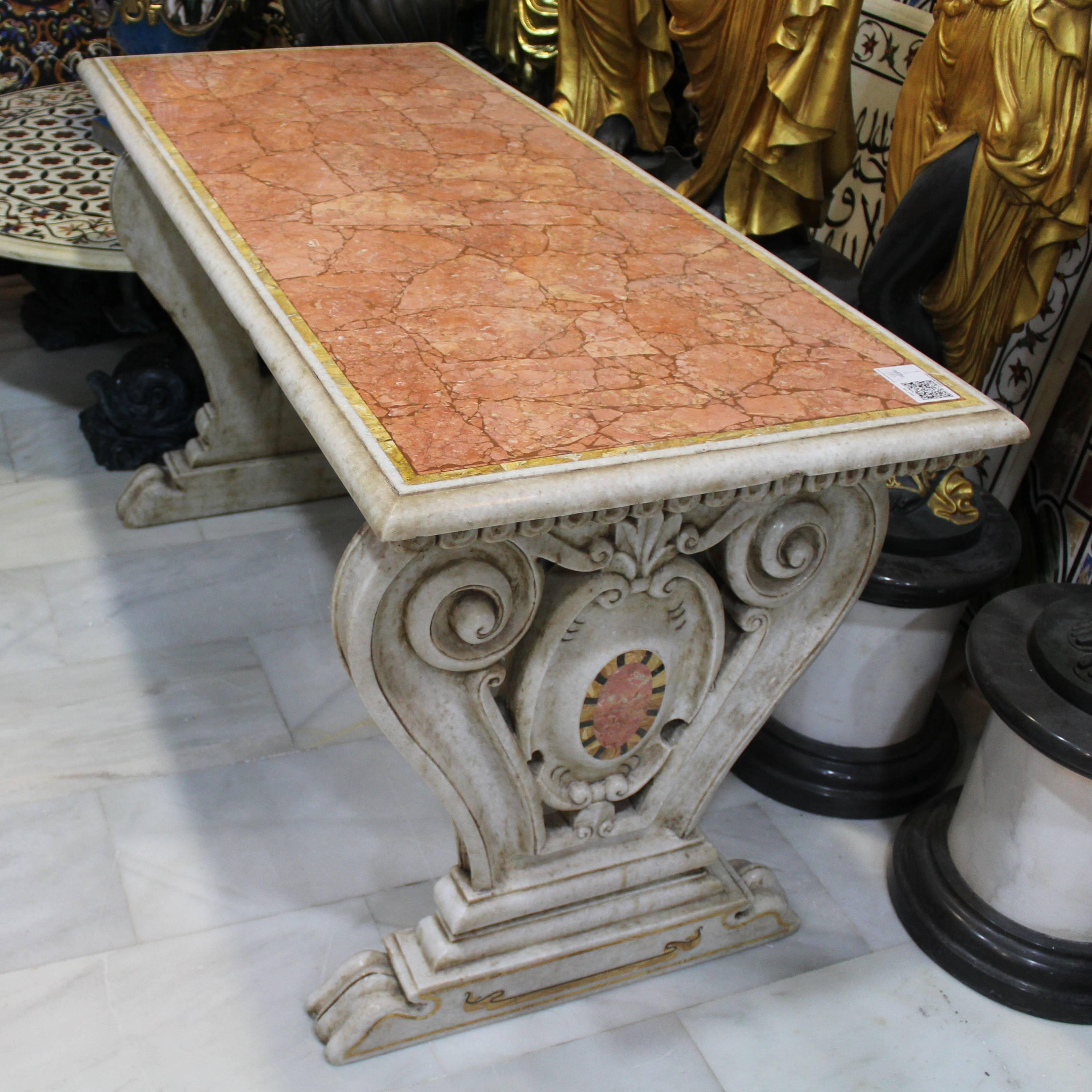 Classical Italian aged Carrara marble table using mosaic and pietre dure inlay techniques of red Verona and other marbles.


 