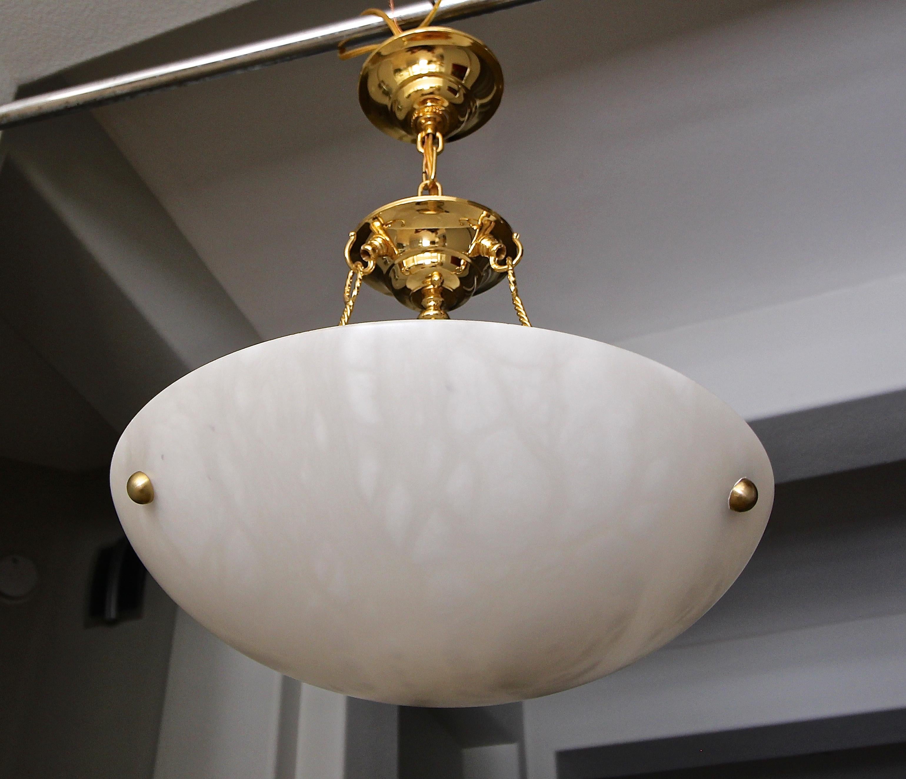 Sleek Italian made alabaster chandelier pendant ceiling 5-light with brass hardware fittings. Fixture uses 5 candelabra size bulbs size bulbs. Perfect for hall entry or smaller eating area. Diameter of bowl 15.75
