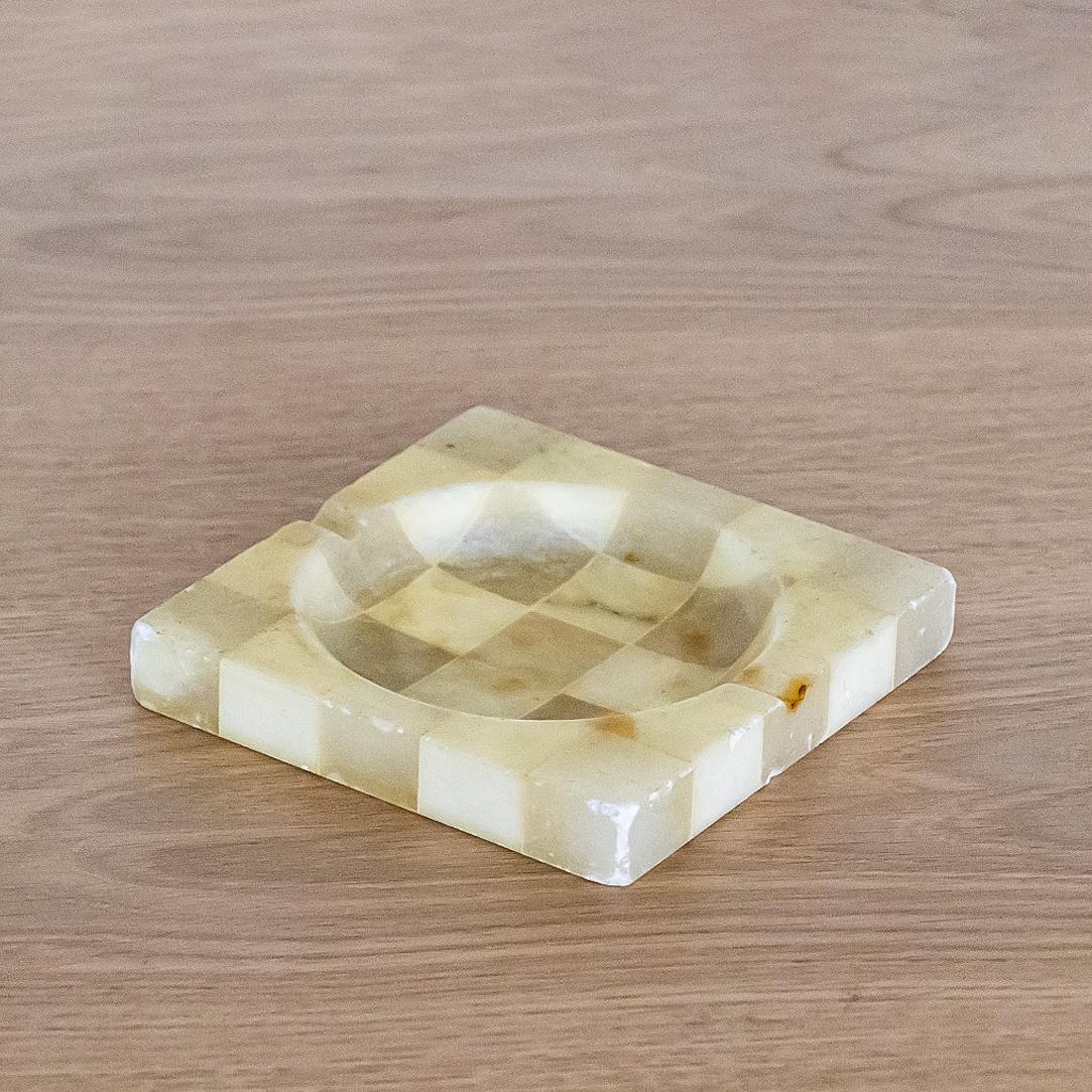 Solid and heavy Italian ashtray made of two-tone checkered ivory and cream alabaster. Original condition and 