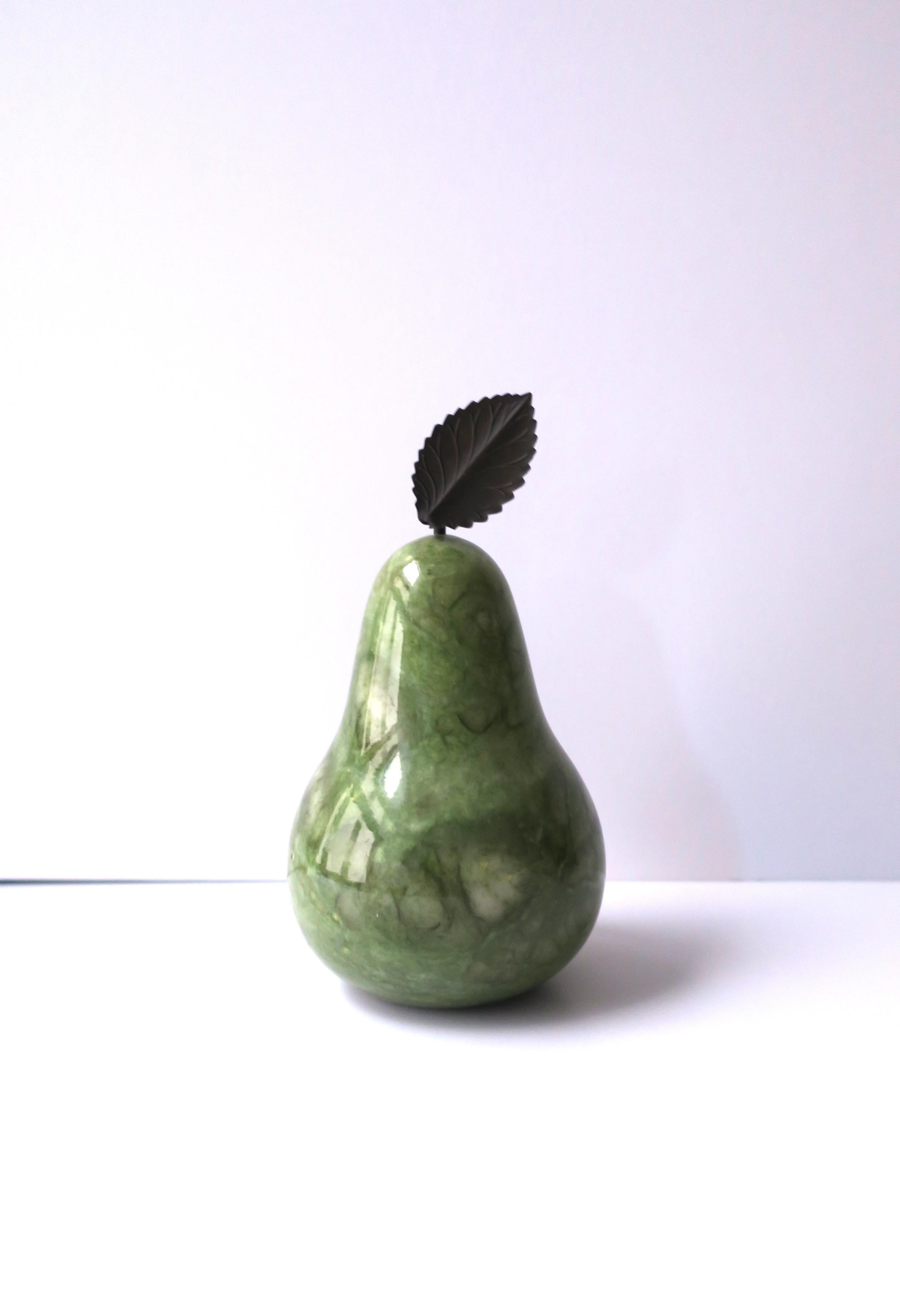 A substantial Italian green alabaster marble pear and leaf sculpture decorative object, circa late-20th century, Italy. Piece could also be used as a bookend. A great piece for a shelf, kitchen, mantle, dining table, etc. Alabaster marble pear is