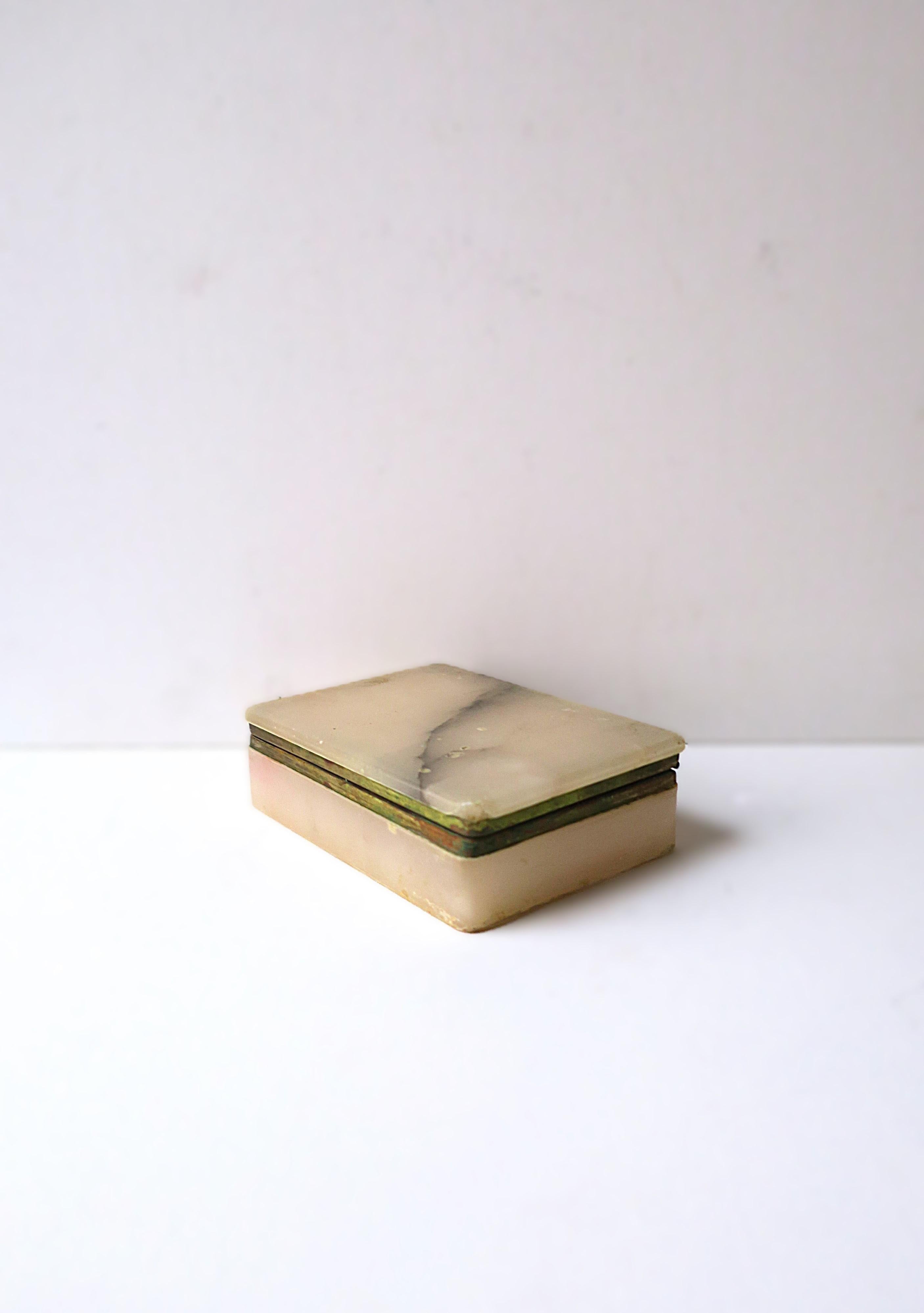 An Italian light powder pink and dark gray alabaster marble jewelry box, attributed to Italian designer Ottone Garantito, '70s Modern, circa 1970s 20th century, Italy. Box is rectangular in a light powder pink with dark gray veining alabaster