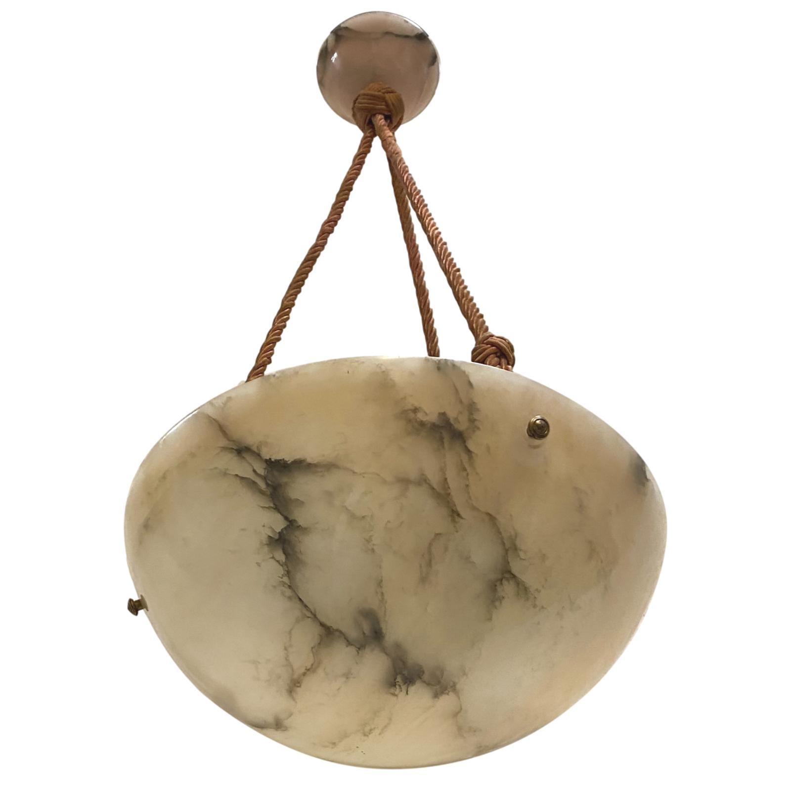 A circa 1920s hand carved Italian alabaster light fixture with silk cords but can be retro-fitted with chain.

Measurements:
Diameter: 14