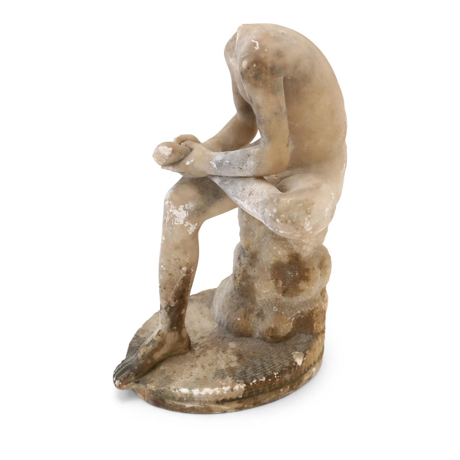 Italian alabaster sculpture of boy pulling thorn from his foot. Dated to the late 19th century and modeled after Spinario. Missing head and other losses.