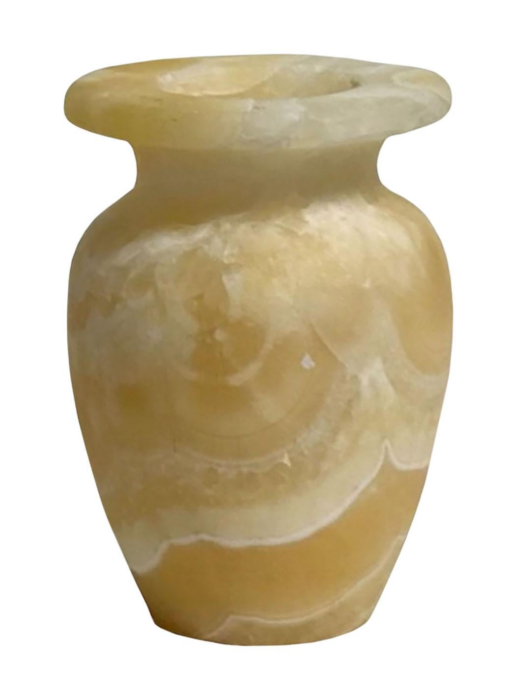 A soft cream colored Alabaster vase is Italian and bought in the 1940s.