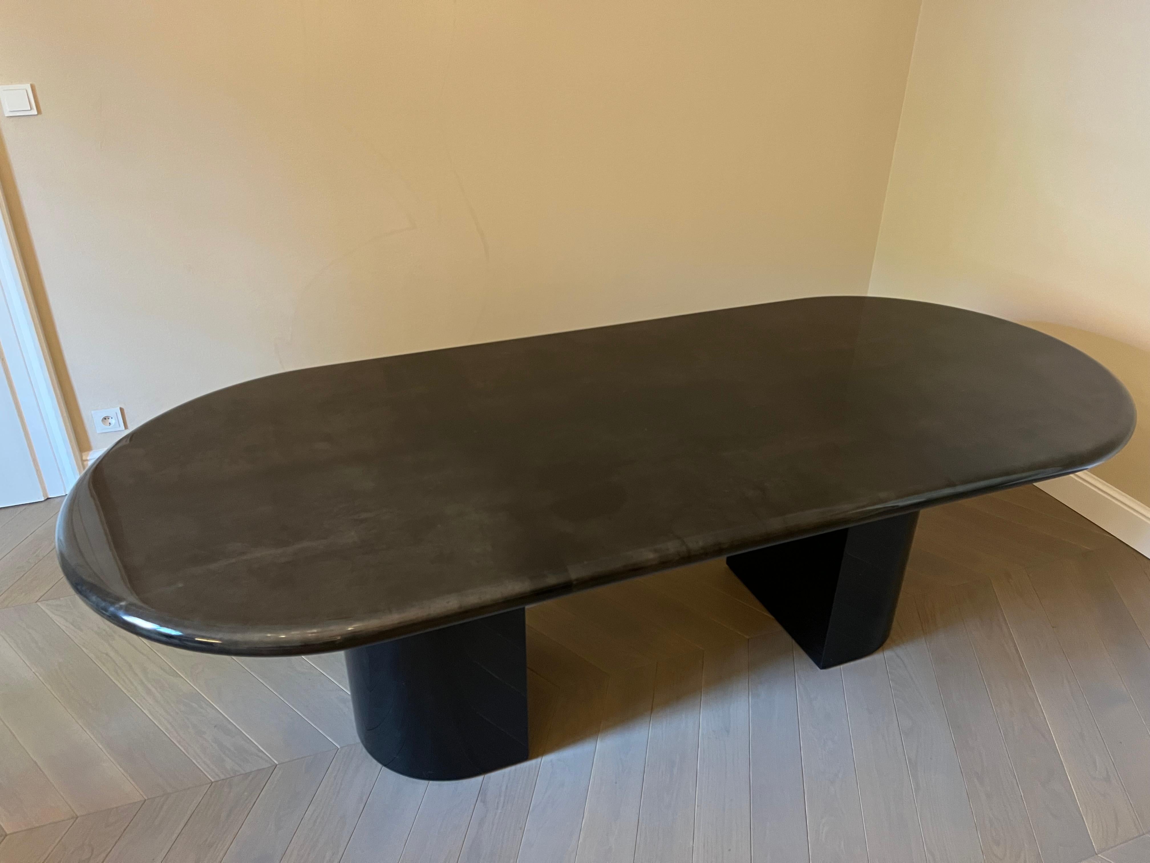 The varnished goatskin parchment, in rich shades of brown, makes this dining table typical of designer Aldo Tura. This beautiful table would make a fascinating piece for a dining or a living room. It’s been beautifully finished for a smooth, glossy