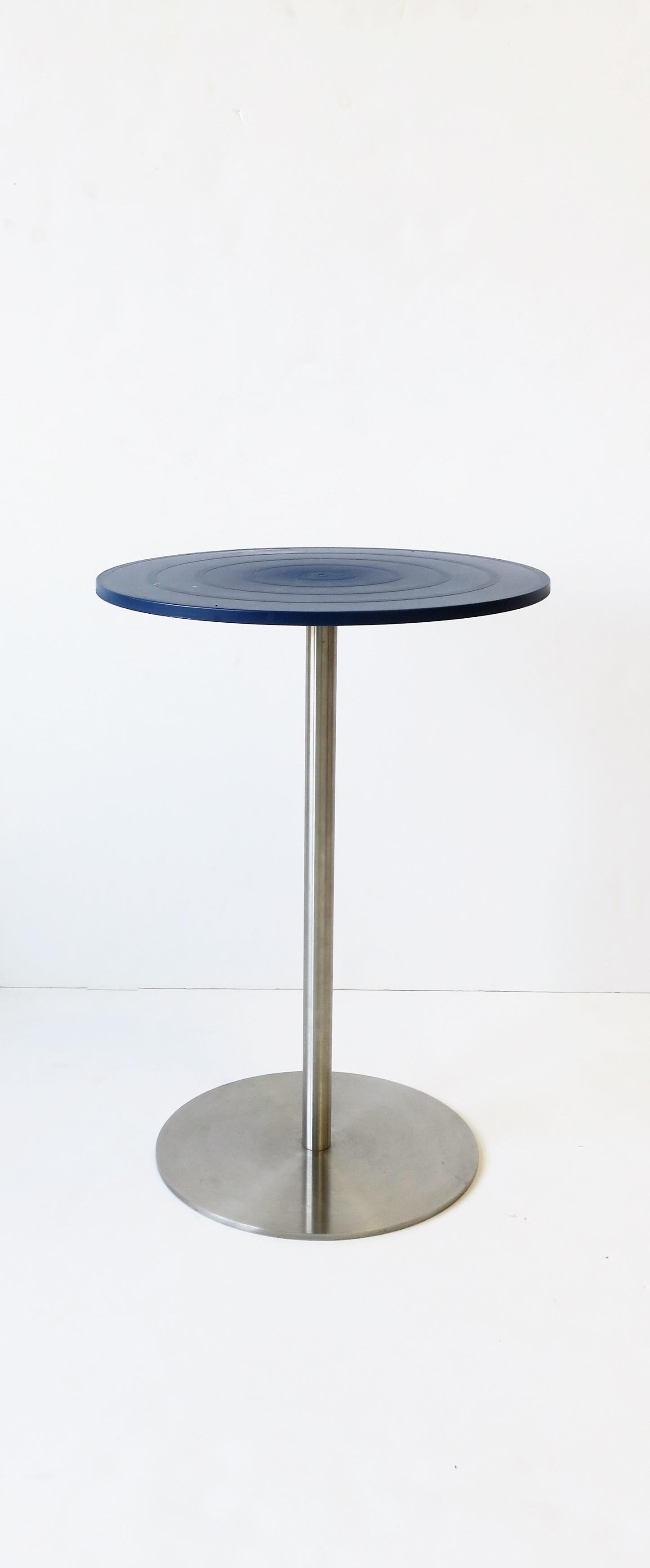 An Alessi Postmodern Italian side or drinks table by designer Jasper Morrison, 1998. Table has a round blue resin/composite top and brush metal base. With maker's mark underneath as shown in image #11; 