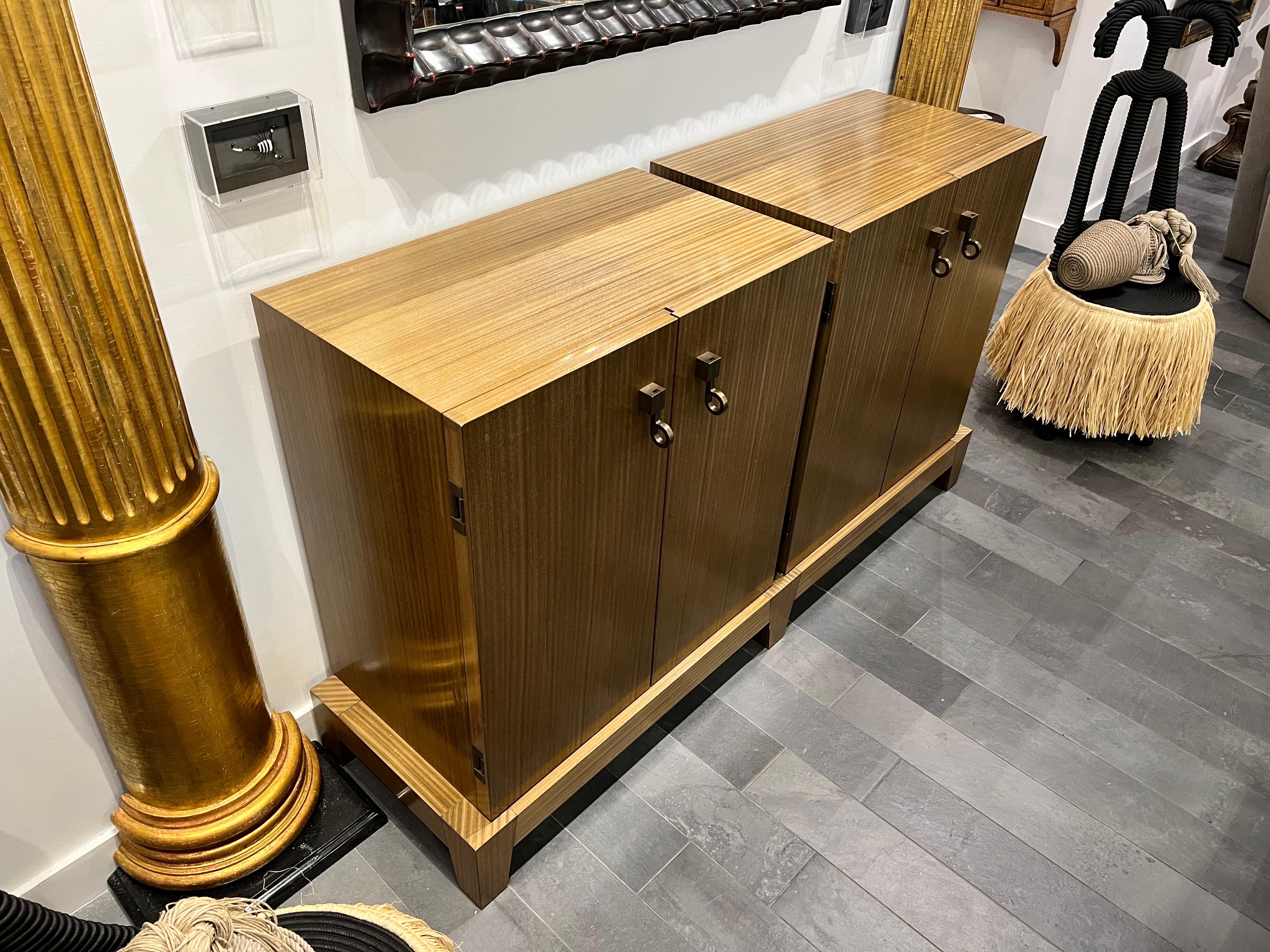 Behold the Amarcord double modular cabinets/chests by Promemoria, a testament to Italian craftsmanship and timeless elegance. These exquisite pieces, crafted in Italy, boast a precious variant that marries light grey mahogany and teak, embellished