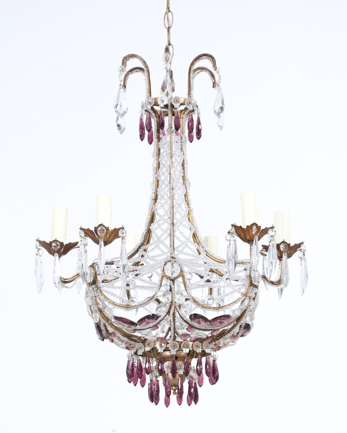 Glorious, 1940s Italian crystal beaded chandelier with amethyst prisms. 

The chandelier consists of an intricately beaded gilt-iron frame with faceted amethyst glass prisms in an assortment of shapes and sizes. 

The chandelier is wired and in