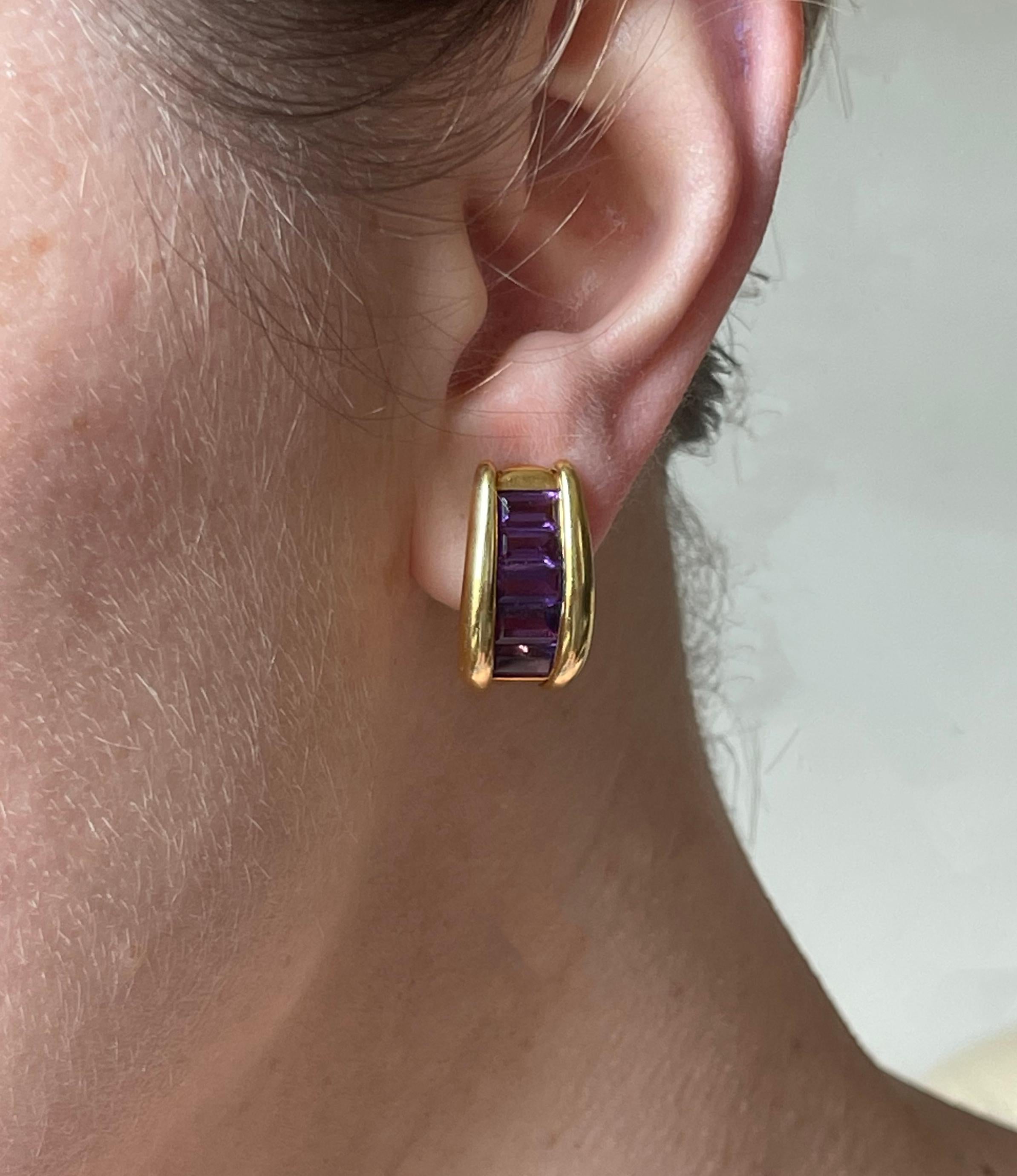 Pair of 18k gold Italian made half hoop earrings, with baguette cut amethyst. Earrings measure 7/8