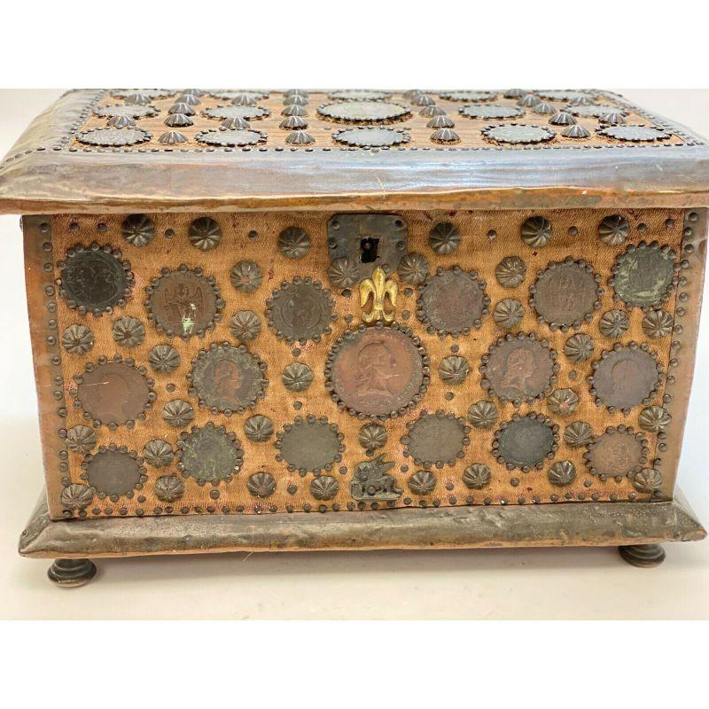 Italian Ancient Coin Mounted Wood Cigar Box Humidor, 19th Century

Italian coin mounted wood cigar box, 19th Century. 50 Italian coins mounted to the exterior walls and lid. Fabric to the interior. The Fleur-dis-lis  designs were likely added at a