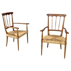Used Italian mid-century modern armchairs wood and straw with two brass feet, 1950s
