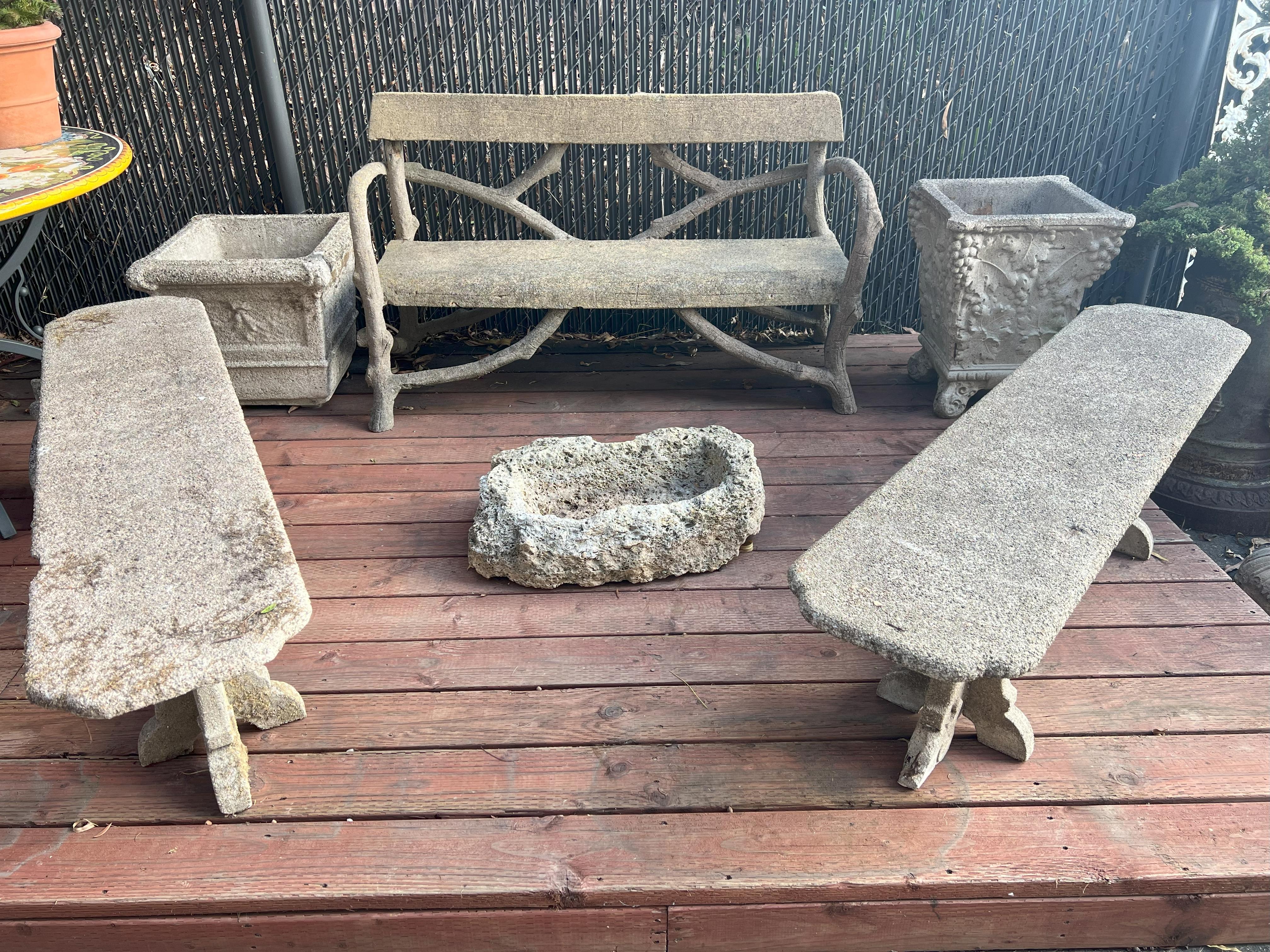 This Italian Antique Art Nouveau Garden Stone Faux Bois Bench, built circa 1920, is an hand crafted concrete garden bench. 
With a faux wood plank as a base and back to the bench, concrete branches and tree trunks extend down to create the four legs