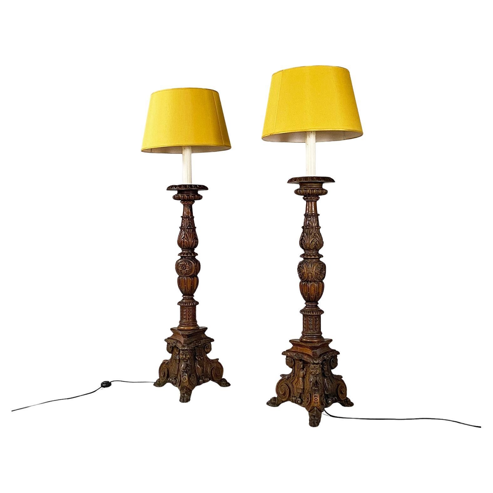 Italian antique carved wood and yellow fabric floor lamps or torch holders, 1500