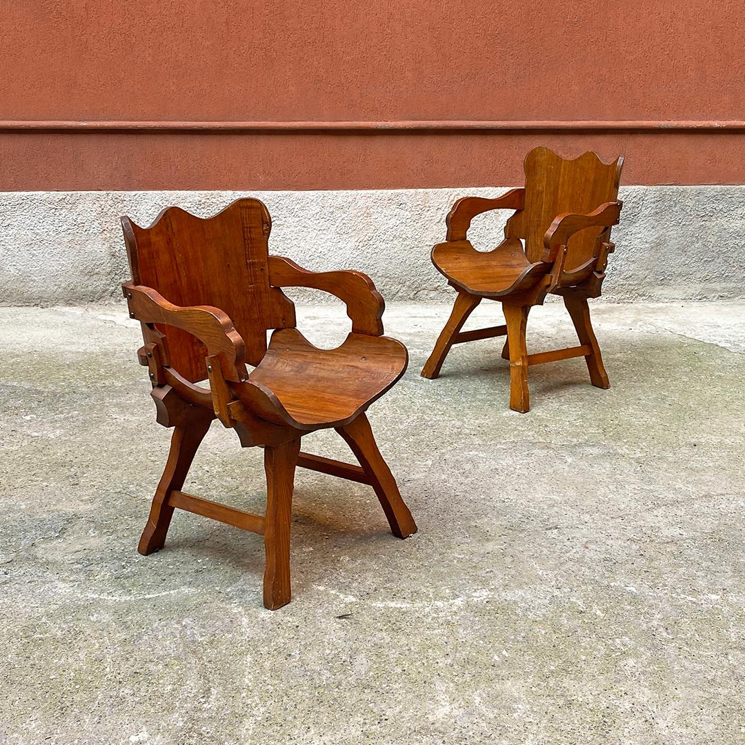 Italian antique curved wood irregular shape pair of rustic armchair, 1930s.
Rustic armchairs in curved wood with seat and back with curved, worked and irregular profiles. Exposed bolts and rectangular section legs always with curved profile.
1930