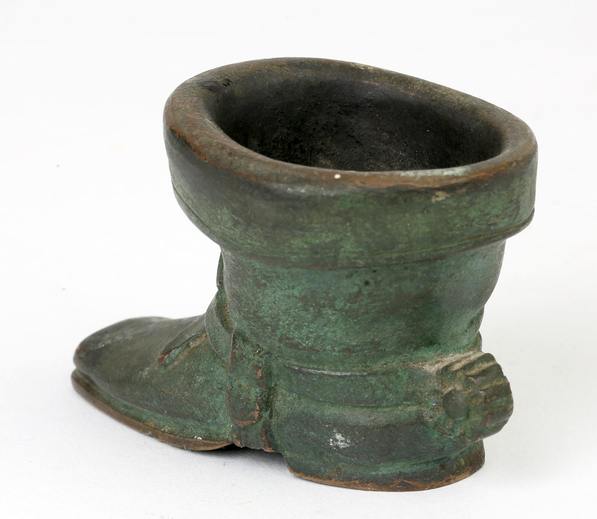 A quality antique Italian Grand Tour bronze boot shaped vesta or match holder dating from 1900. Modeled as a riding boot with a spur strapped to the boot with the body of the boot acting as a container, probably for matches. The boot has a wonderful