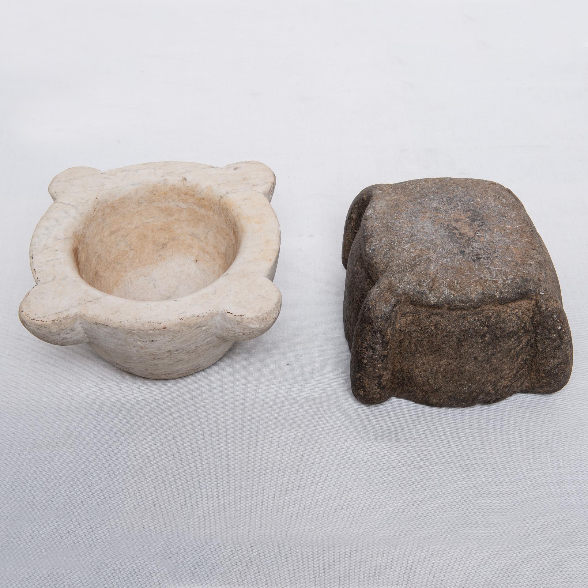 Two antique mortars for Your kitchen: one in white marble, smaller; the other one (darker) in stone, more antique.
The mortar is very useful in the kitchen: in Italy it is used to crush pine nuts with basil and obtain 