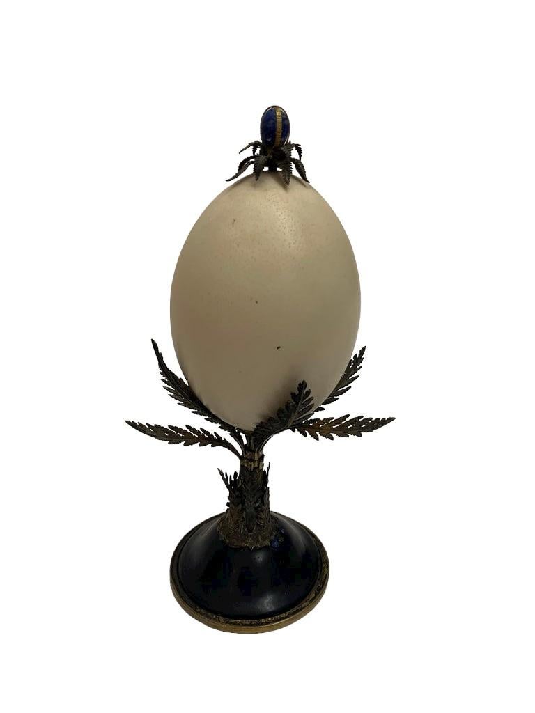 Italian antique ostrich egg with brass carved leaves and details and a lapis lazuli small egg on top.

Property from esteemed interior designer Juan Montoya. Juan Montoya is one of the most acclaimed and prolific interior designers in the world