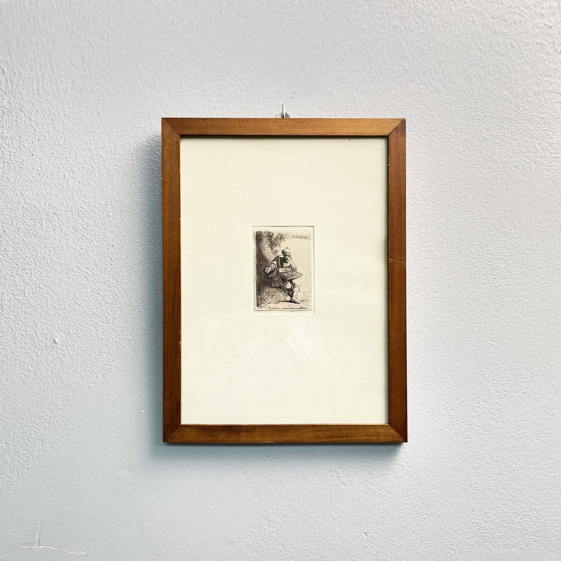 Antiquité italienne Image de gravure d'un vendeur de rue dans un cadre en bois, 1800s
Impression réalisée à l'aide de la technique de la gravure à l'eau-forte sur papier, représentant un vendeur de rue vendant des marchandises à partir de son