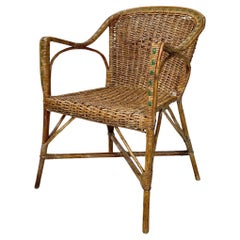 Italian antique rattan chair with armrests and green details, early 1900s