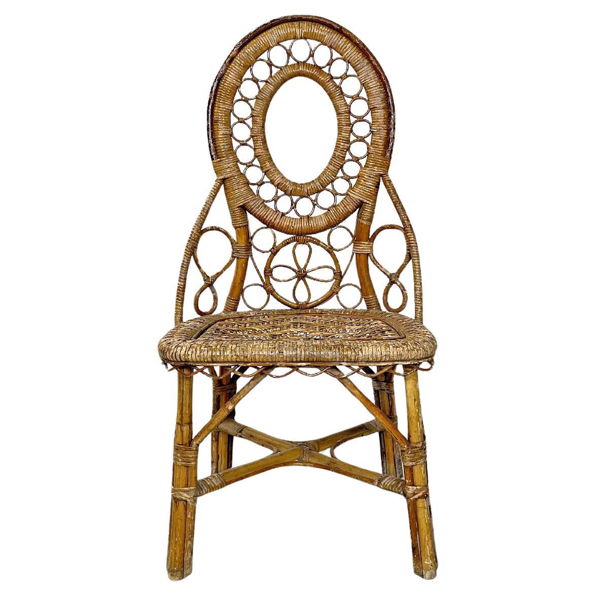 Italian antique rattan chair with floral and geometric decoration, early 1900s For Sale