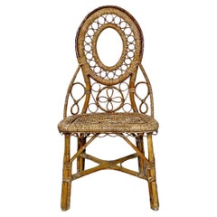 Italian Used rattan chair with floral and geometric decoration, early 1900s