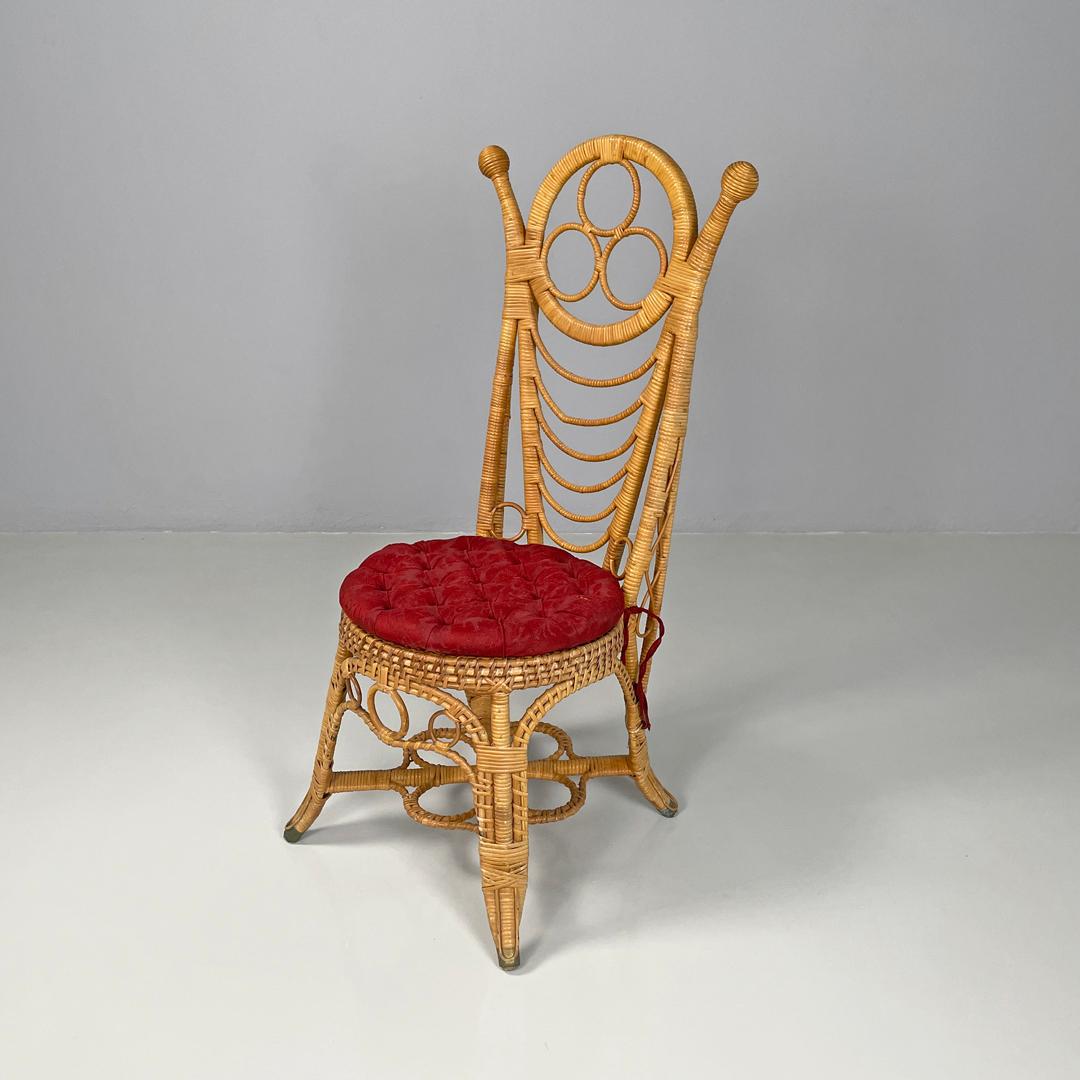 Italian antique rattan chairs with round decorations and red pillows early 1900s
Set of four rattan chairs with padded cushion and covered in brocade fabric in shades of red, with buttons. The structure follows curved and rounded lines, the backrest