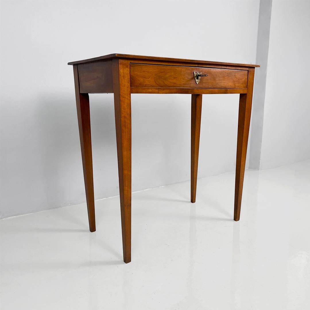 Italian antique rectangular wooden desk with drawer, 1750s
Desk or writing table with a rectangular wooden top. The table features a hidden drawer on the front. The legs are square.
1750s
Vintage condition, with signs of use and age, including some