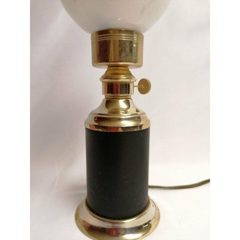Italian antique rococo brass and metal table lamp with opaline glass shade
Dimensions: 33 cm H x 9 W cm bottom of the lamp 
In good condition 
Please refer to the photos for details, sizes and condition as it makes part of the description 
It