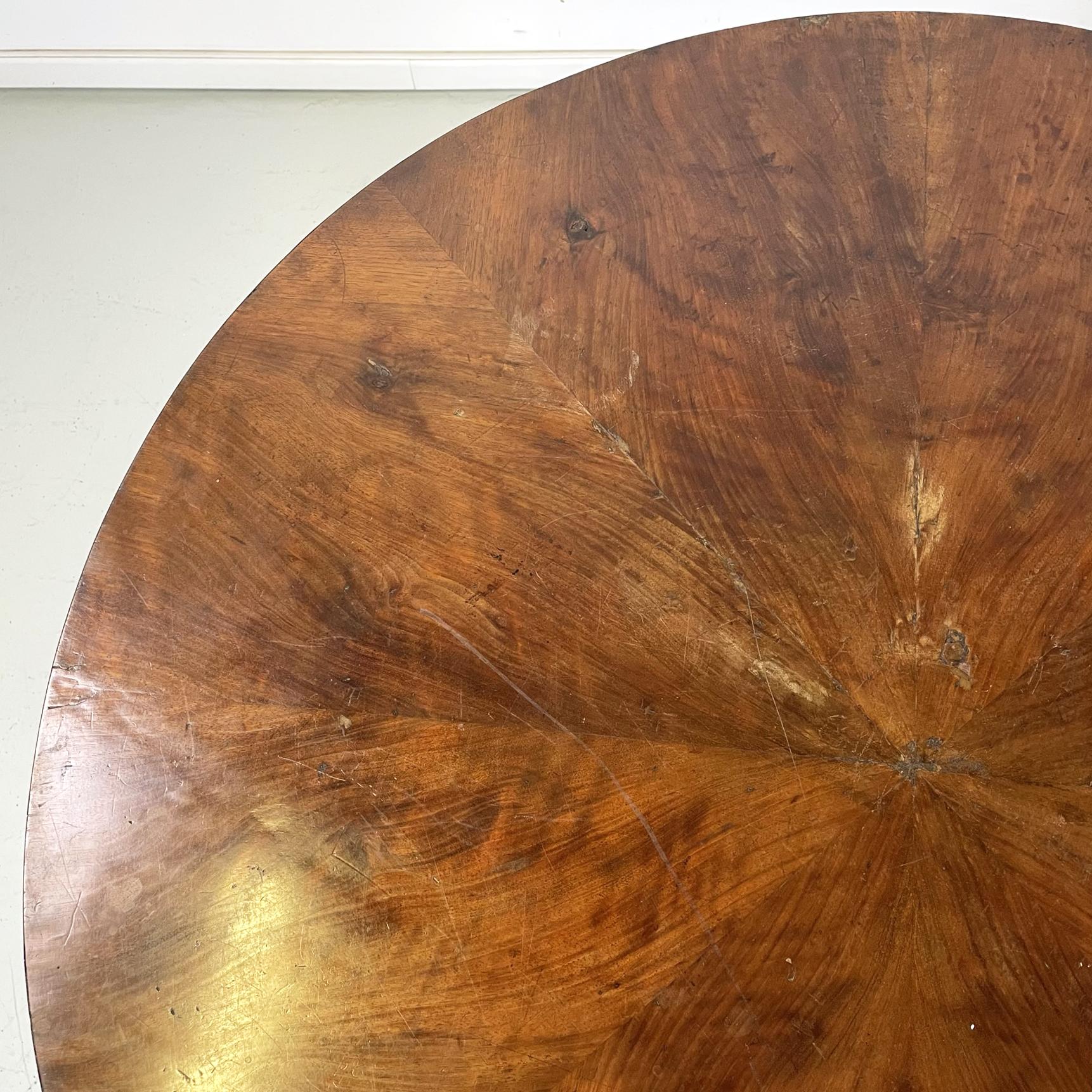 Wood Italian antique round and finely worked wood dining table, 1800s         For Sale