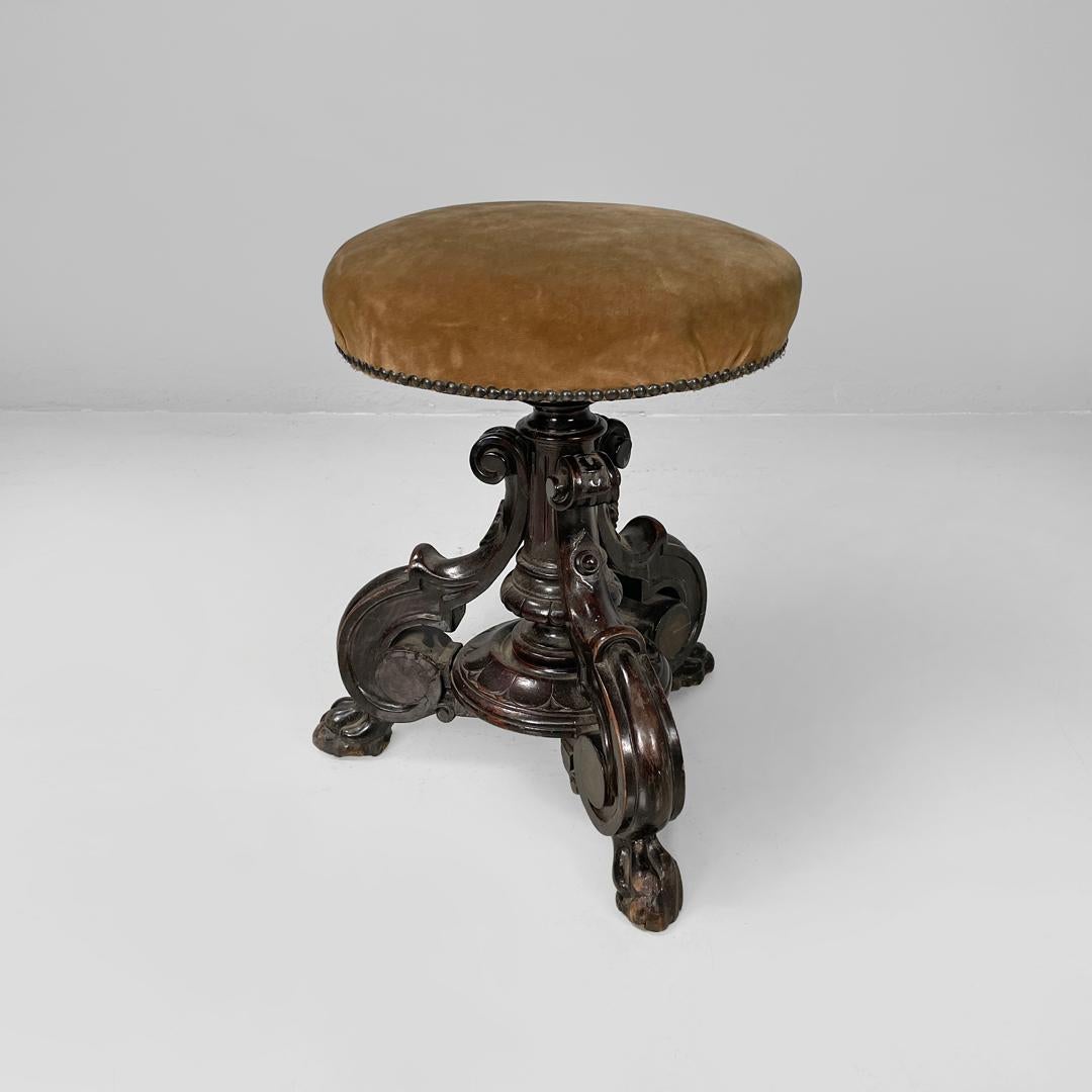 Italian antique round seat stool in decorated wood and brown velvet, late 1800s
Stool with round seat padded and covered in light brown velvet with brass studs. The structure is made of wood, the central stem and the three legs are decorated with