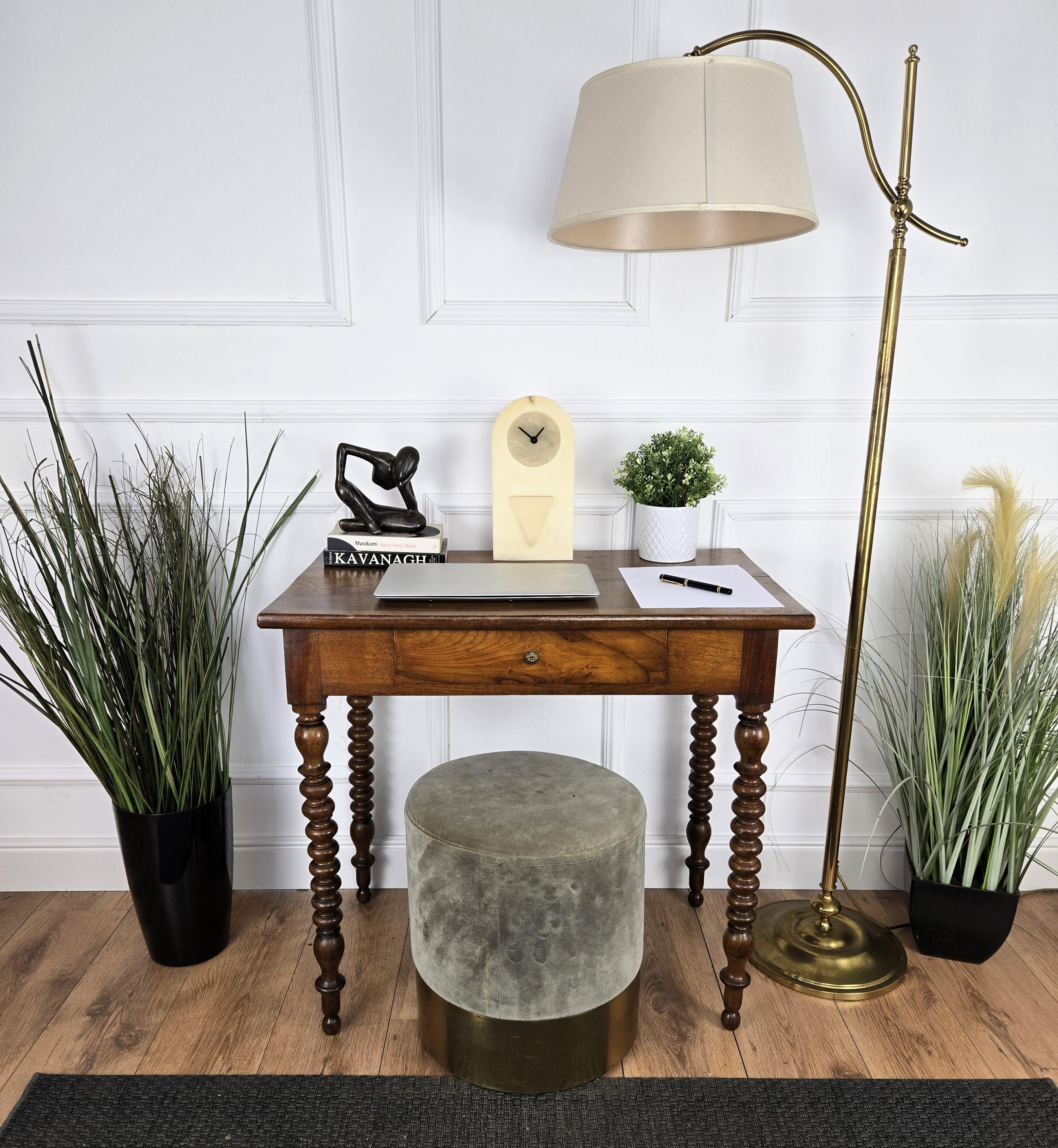Very charming and elegant Italian antique table desk writing table in solid walnut wood with stylish bobbin turned carved legs and central drawer. Ideal in any room as a small stand alone corner desk console as well as next to the wall.
