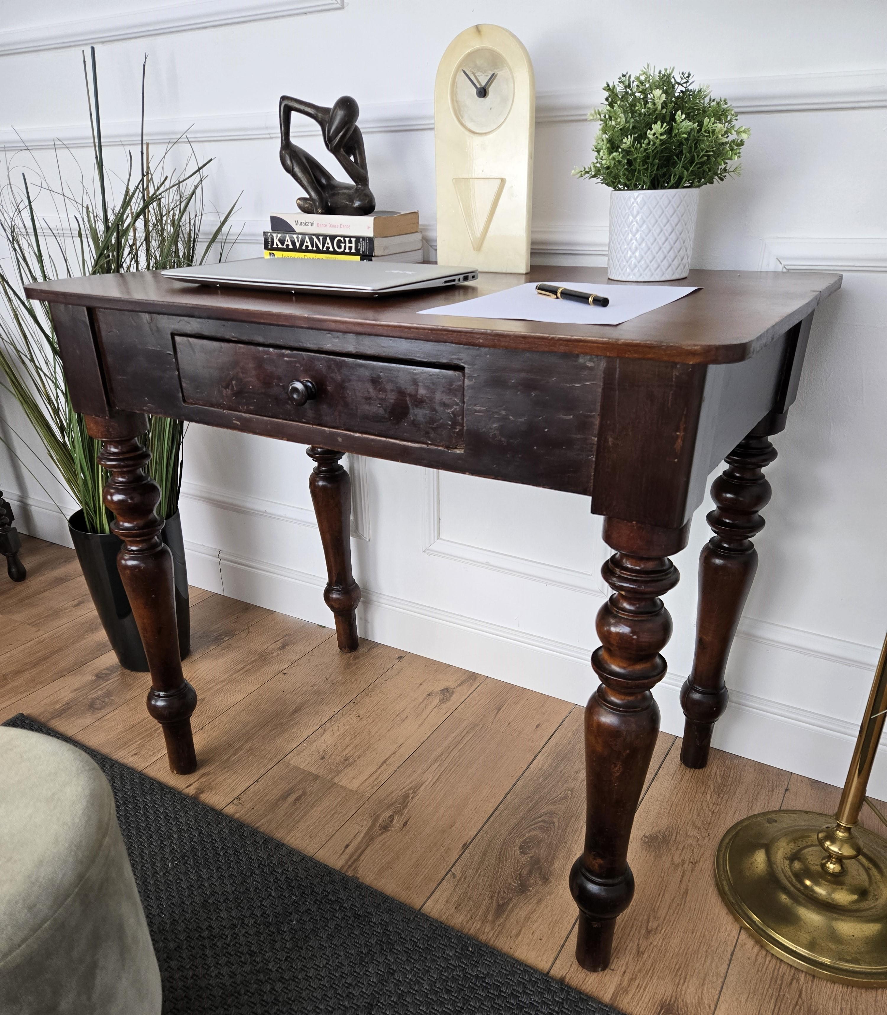 Very charming and elegant Italian antique dining table or desk writing table in solid walnut wood with stylish carved legs and central drawer. Ideal in any room as a small stand alone corner desk as well as next to the wall.
