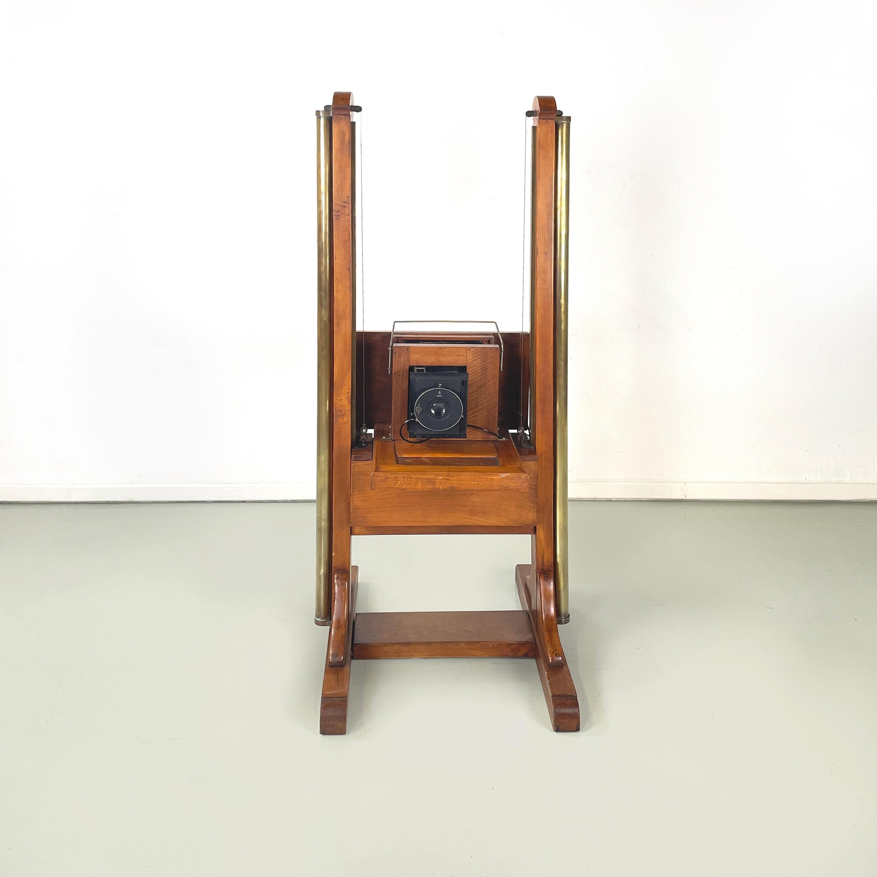 Italian antique vintage Analogue floor camera in wood and brass, 1900s
Analogue floor camera in wood and brass. The structure is composed of two solid wood uprights with brass cylinders, which allow the lens to raise and lower through thin cables.