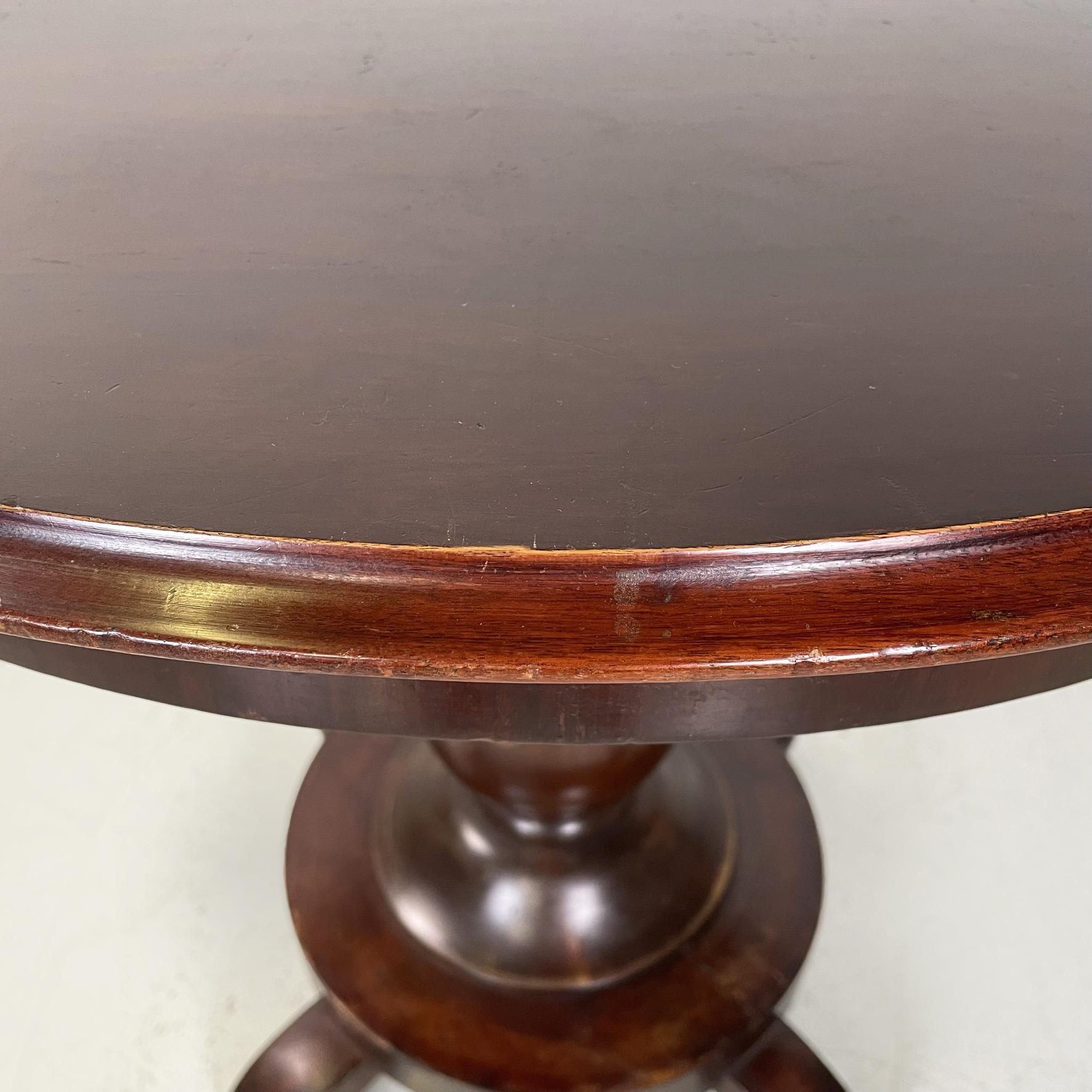 Wood Italian antique walnut round and finely worked wood dining table, 1800s         For Sale