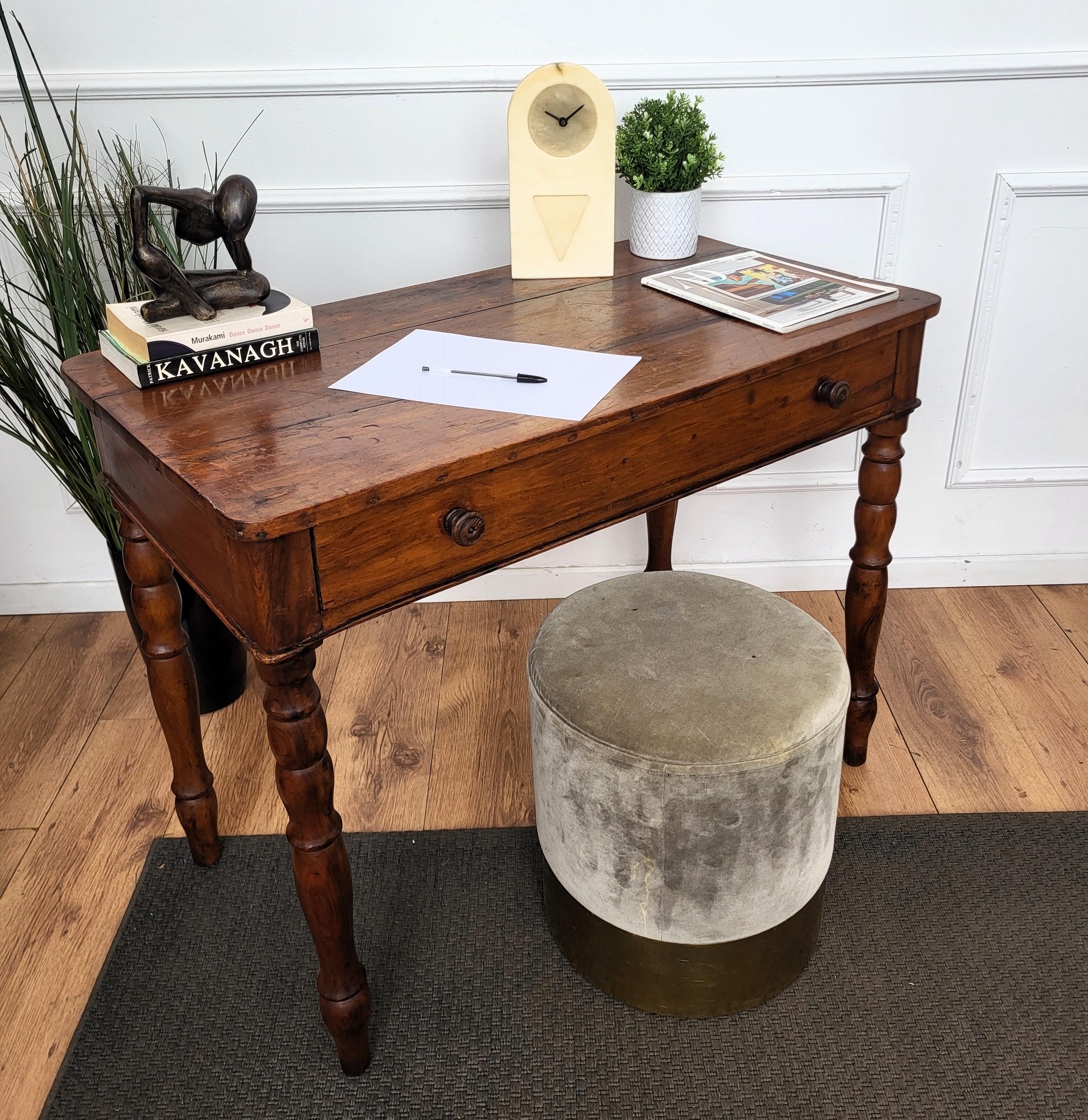 Very charming and elegant Italian antique table or desk writing table with stylish carved legs, solid wood and central drawer. Ideal in any room as a small stand alone corner desk as well as next to the wall.