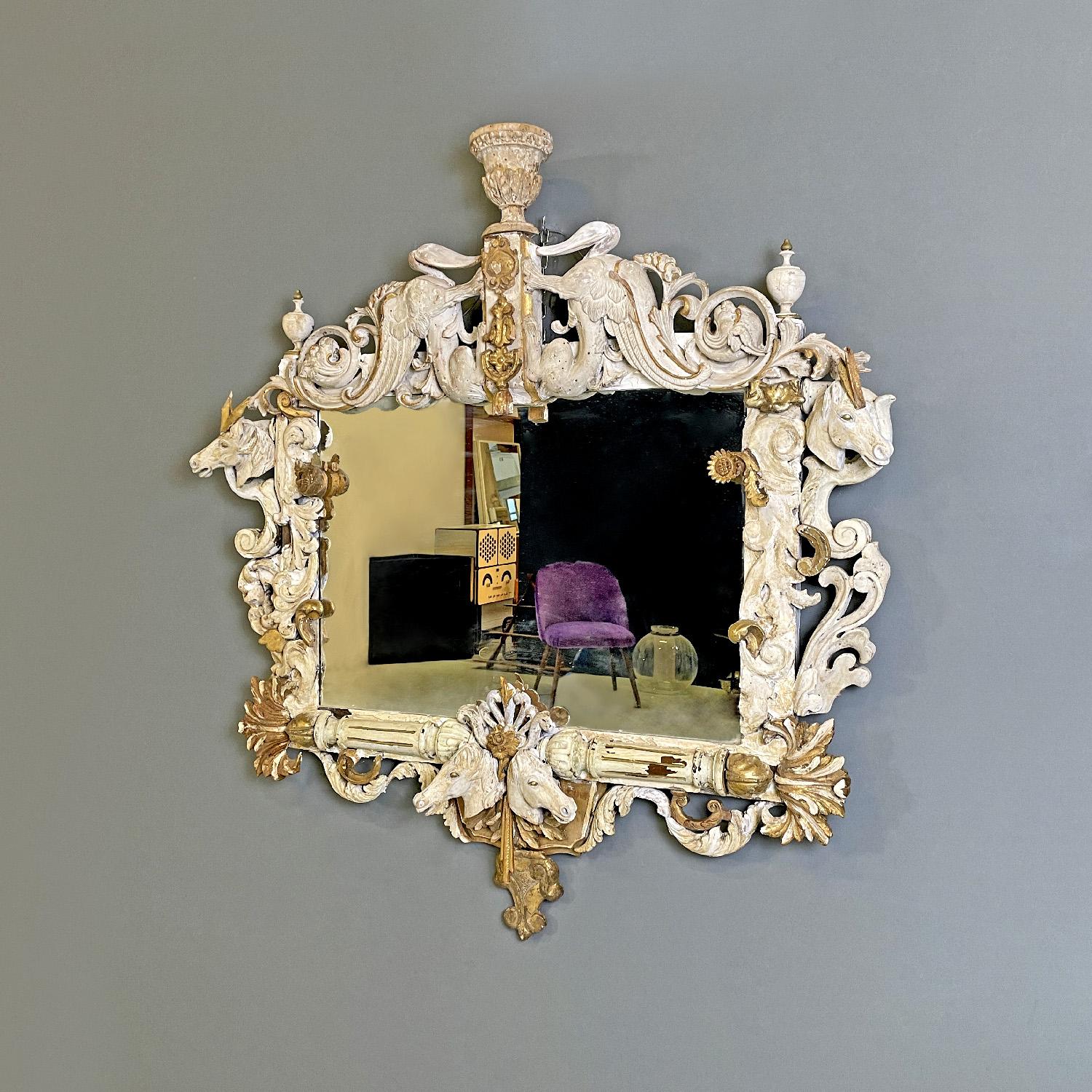 Italian white and golden wood wall mirror with animal decorations, 1990s
Rectangular wall mirror with finely decorated frame. The relief decorations recall the vegetal world, such as acanthus flowers and leaves, and animals, in the lower central