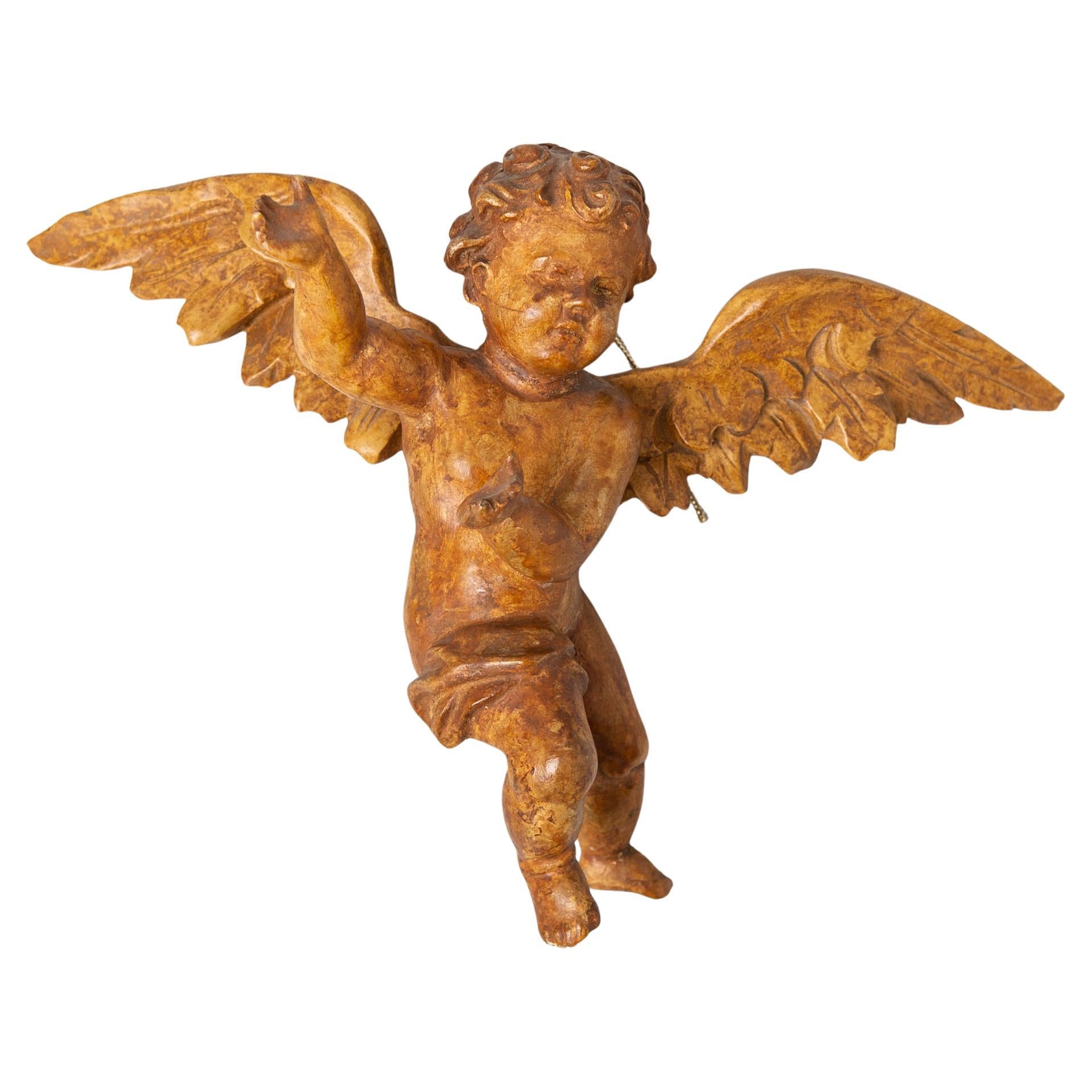 Antique wooden angel from the mid 1800's, with traces of lacquer but no trace of gilding: I could gild it, but I prefer it as it is.
To hang anywhere You want to see it, for good luck and protection.
