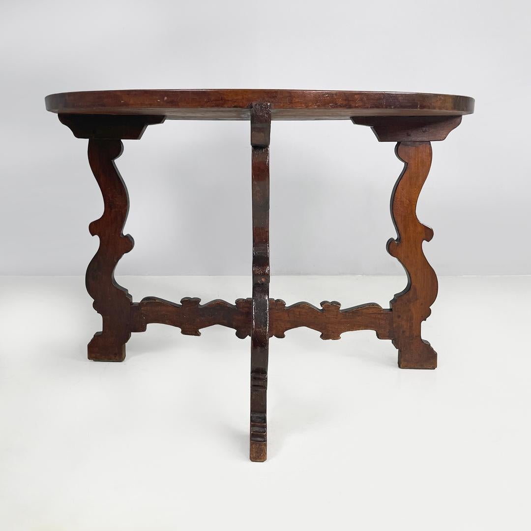 Italian antique wooden round dining table with decorated legs, early 1800s For Sale 1
