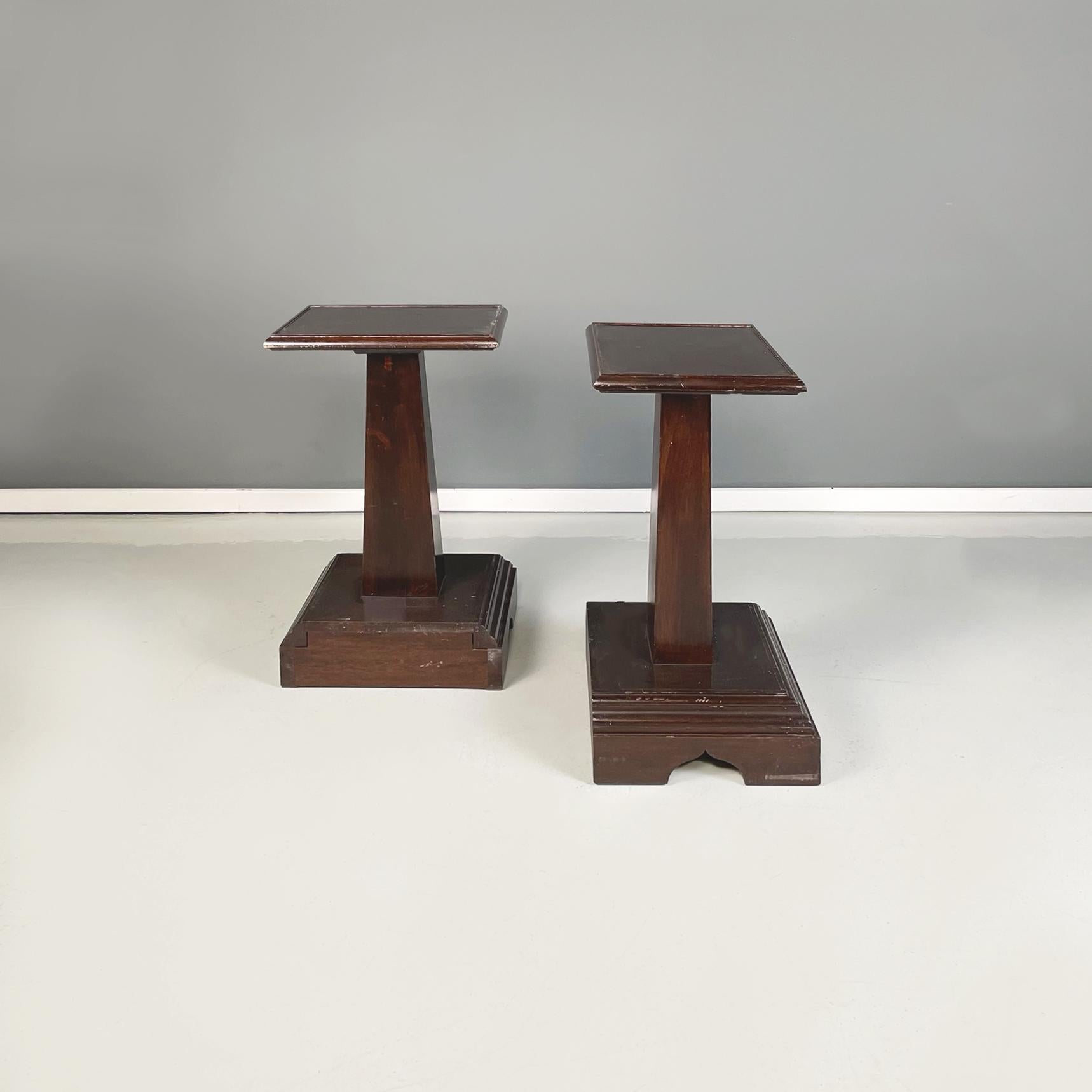 Italian Wooden side tables or pedestals, early 1900s
Pair of side tables or pedestals in dark wood. The rectangular top is supported by a central column with a square section. The rectangular base is finely crafted. Suitable as exhibitors of small