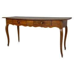 Italian Used wooden table with two drawers brass handle and wavy legs, 1700s