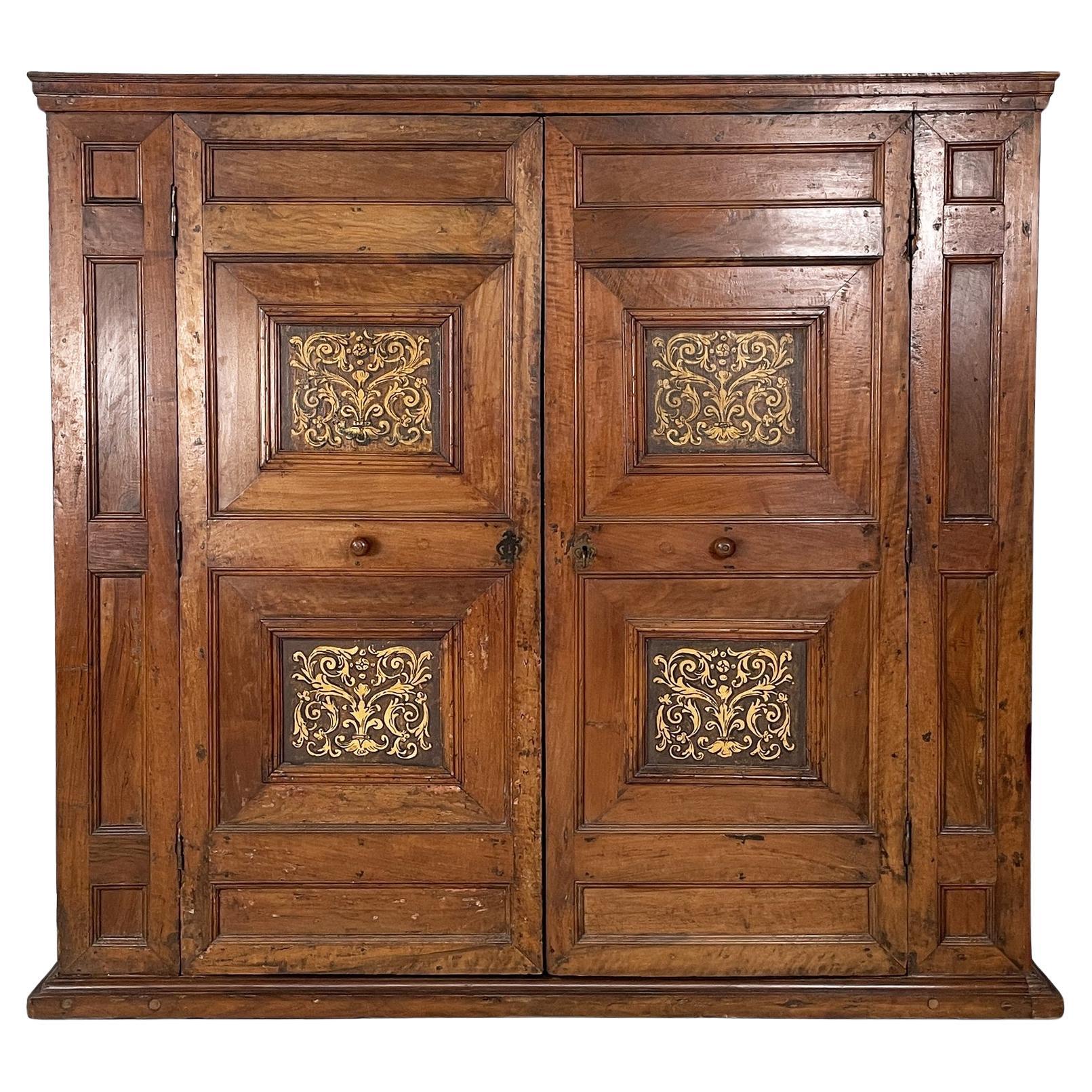 Italian antique wooden wardrobe with decorated doors, 1800s in vendita