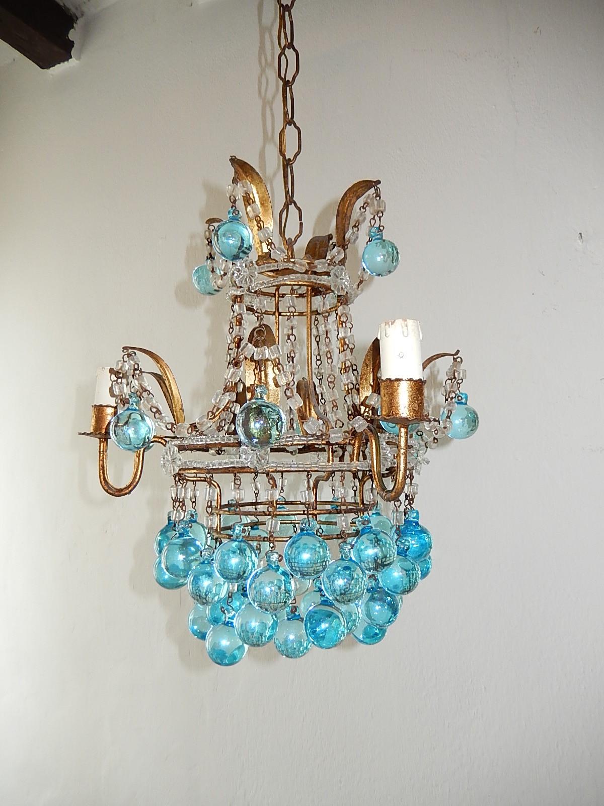 Housing 3 lights. Will be rewired with certified US UL sockets for the USA and appropriate sockets for all other countries and ready to hang!  Gilt metal body with tiny beading and florets. Gilt metal with swags of crystal and aqua blue Murano