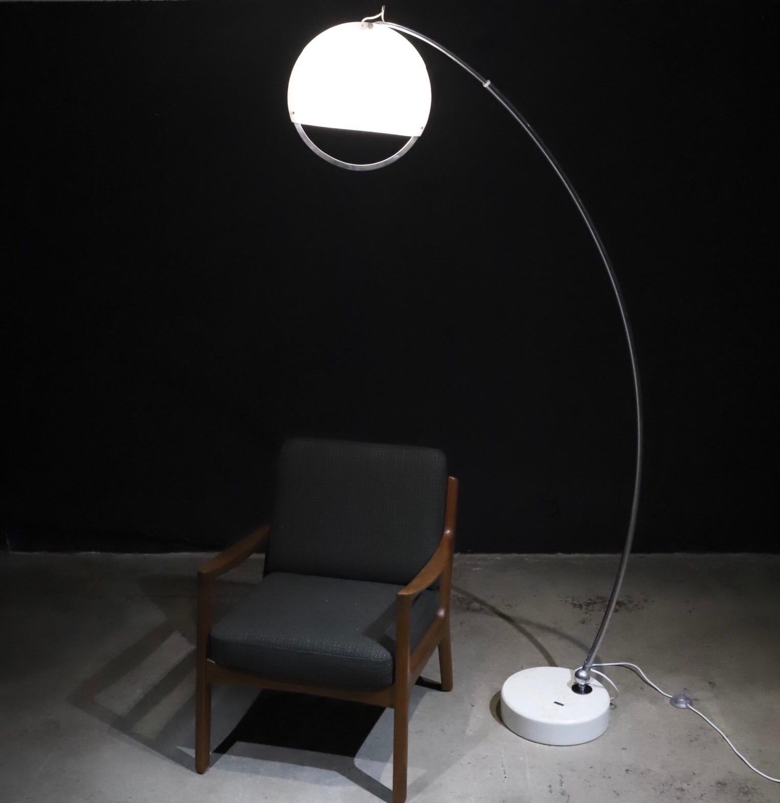 Adjustable. Simplistic oversized lamp for that single reading chair or extend the neck for that over the sofa statement lamp. Chrome body with marble base and molded two-piece globe with aluminum detail hoop. Pictured with Ole Wanscher armchair and