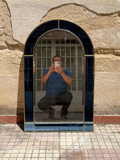 Italian arched mirror with a blue glass frame in the style of Cristal Arte, 1970