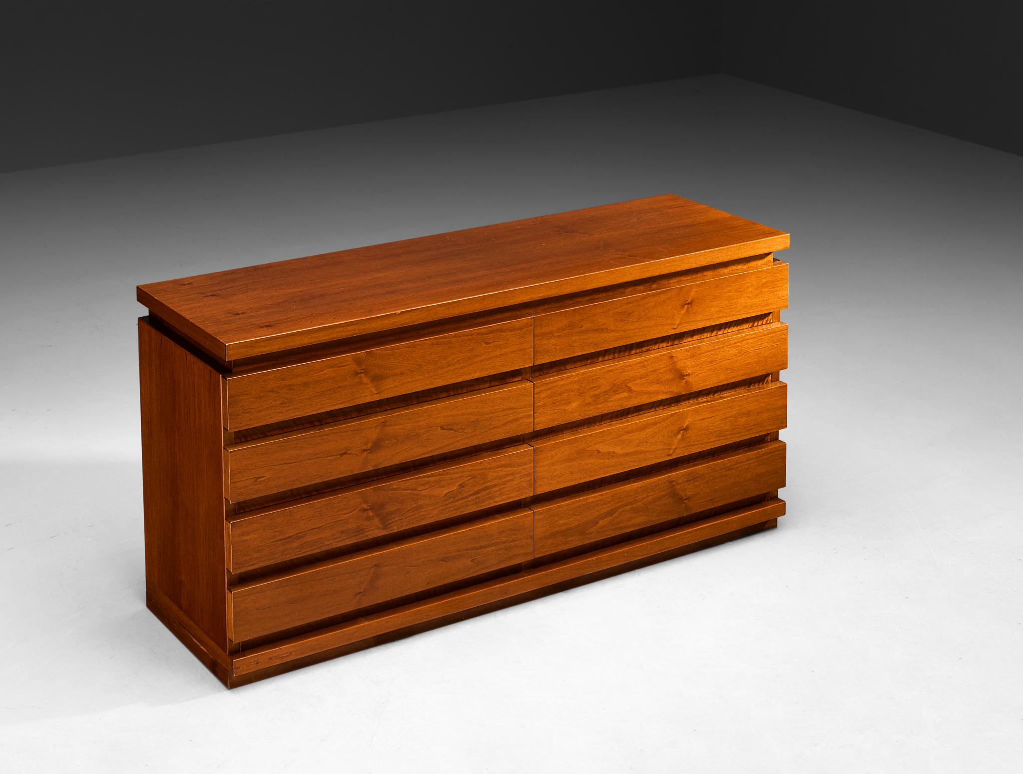 Chest of drawers, walnut, Italy, 1970s

This Italian chest of drawers from the 1970s showcases a design rooted in modernist aesthetics. Crafted from beautifully grained walnut, the piece features a striking horizontal rhythm created by the