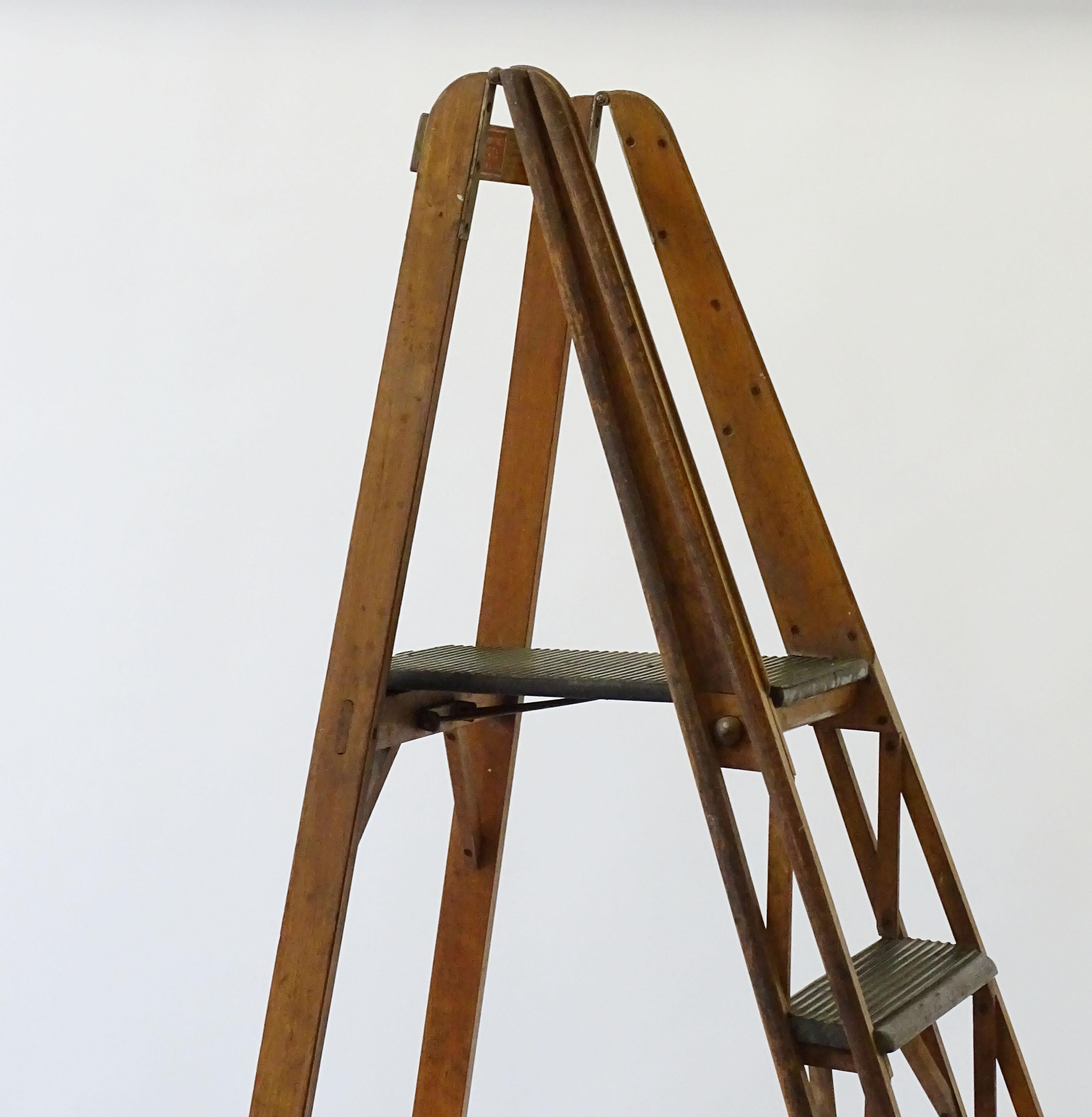 Italian Architectural Free-Standing Library Ladder 
Attributed to Franco Albini, 1950s.
Manufactured by Scorta, Milano
Each step has Green, non-slip plastic strips.
Measurements when closed 56 x 13 x H 222 cm
